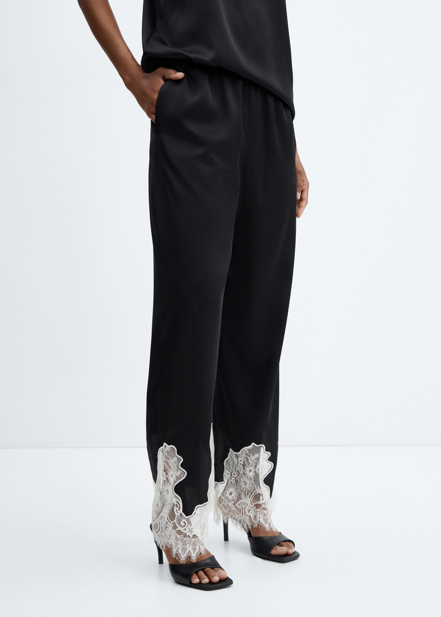 Trousers with lace hem detail