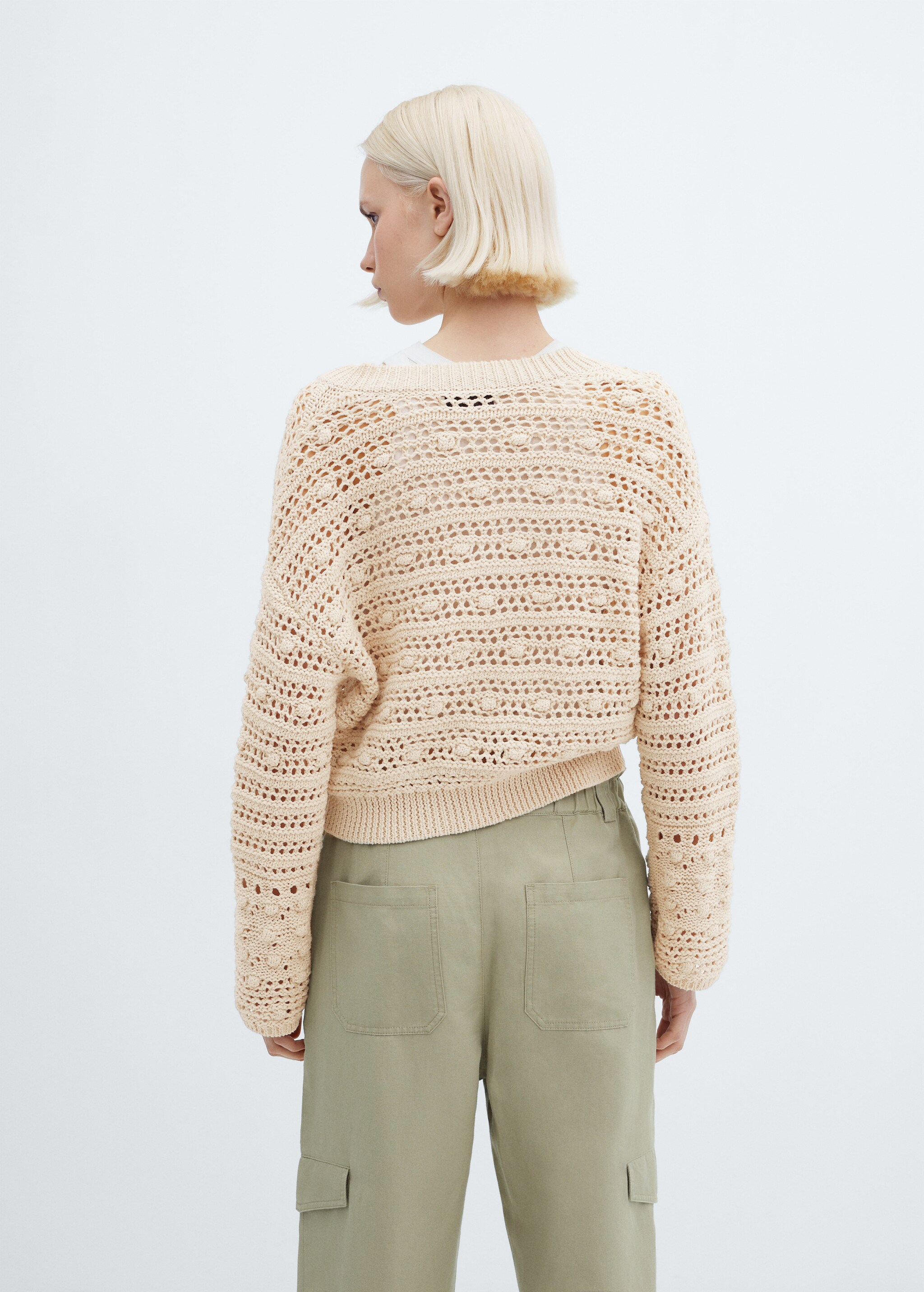 V-neck openwork knitted sweater - Reverse of the article