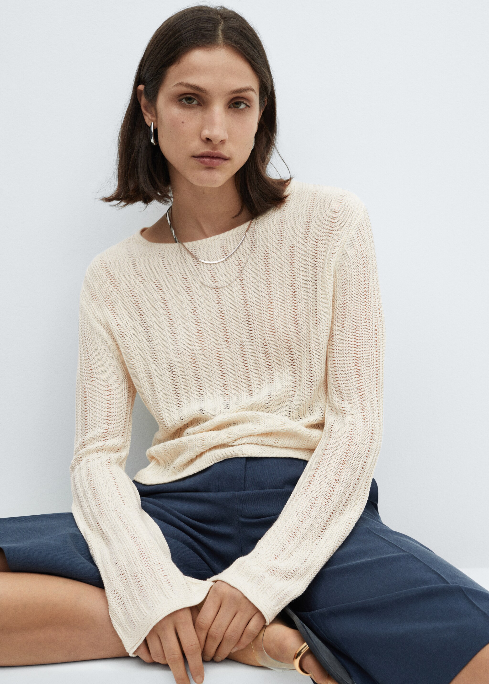 Unstitched sweater with flared sleeve  - Details of the article 1