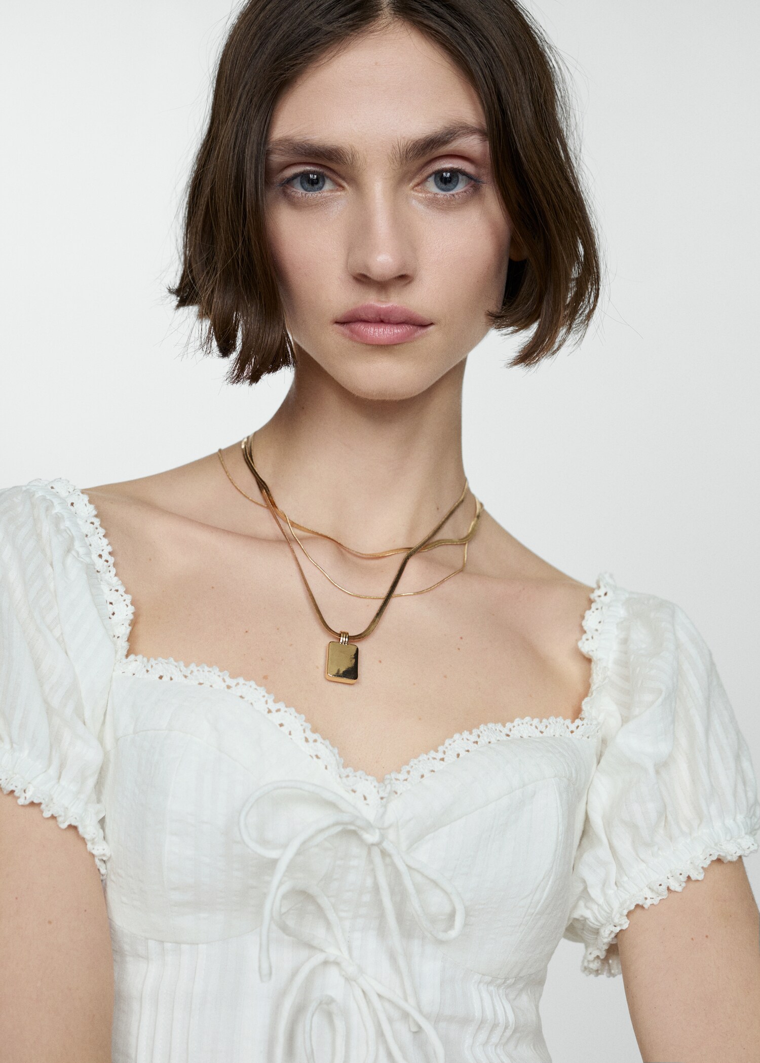 Cropped blouse with bow detail - Woman | MANGO USA