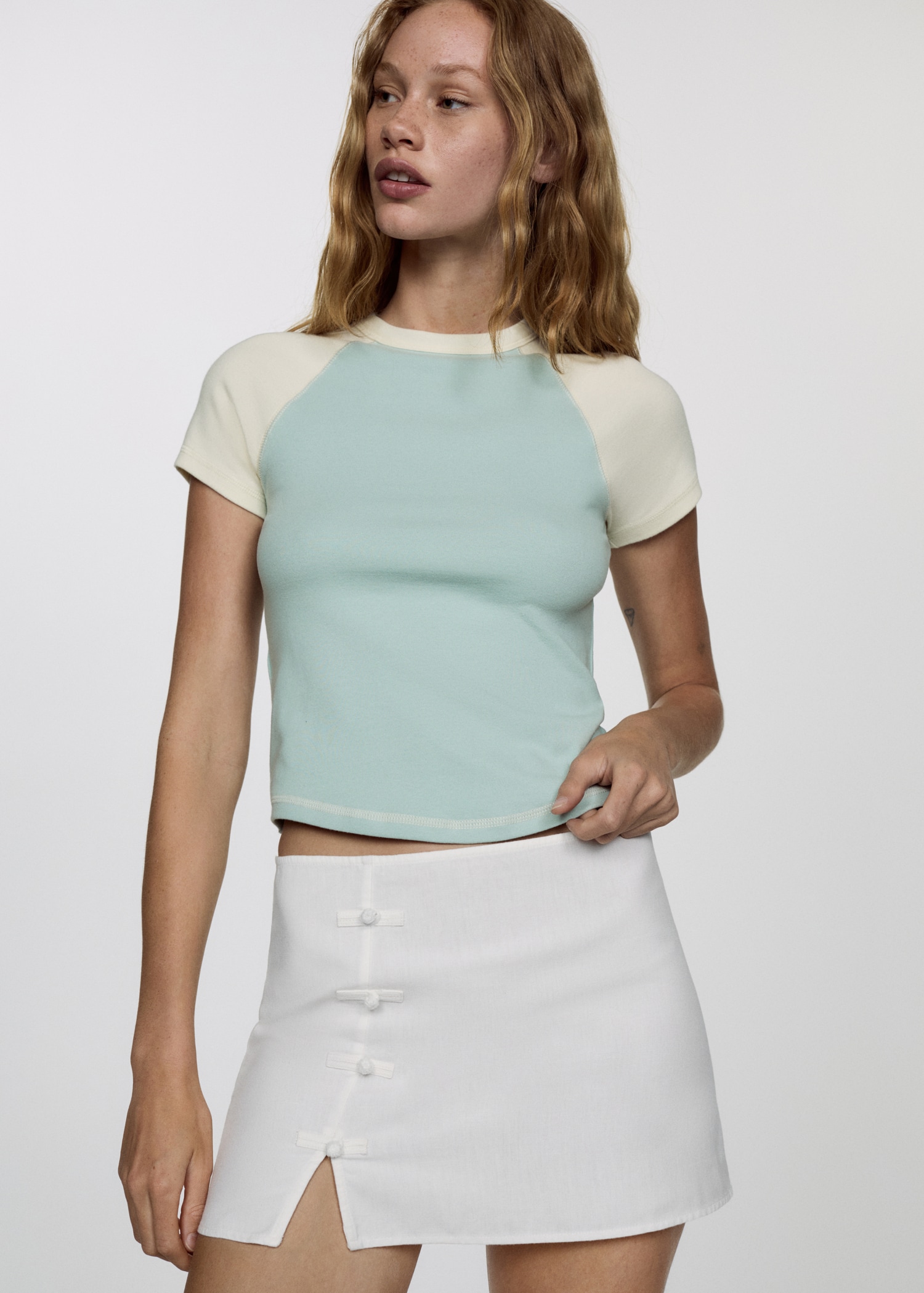 Mini-skirt with decorative buttons - Medium plane