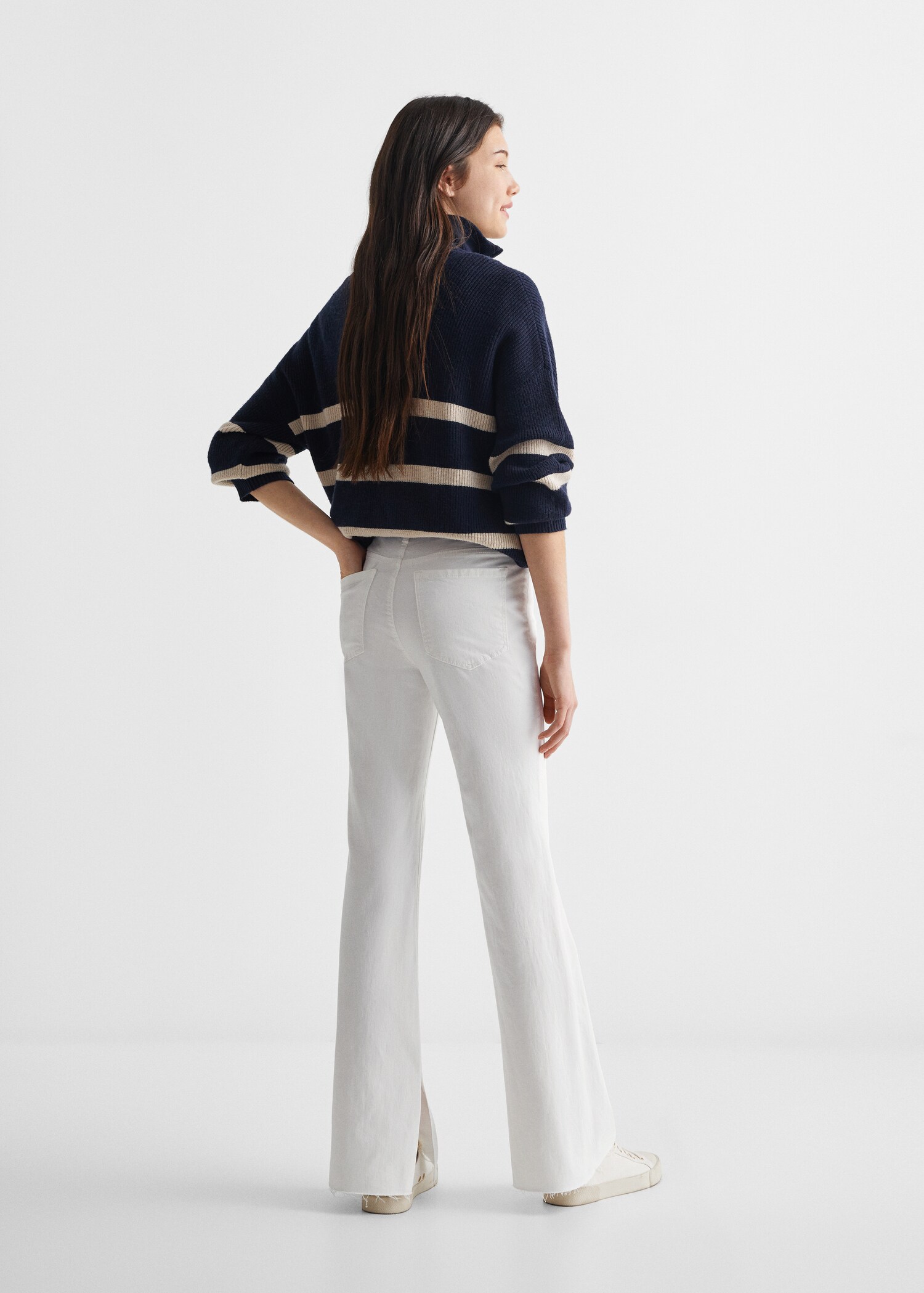Flared jeans with opening - Reverse of the article