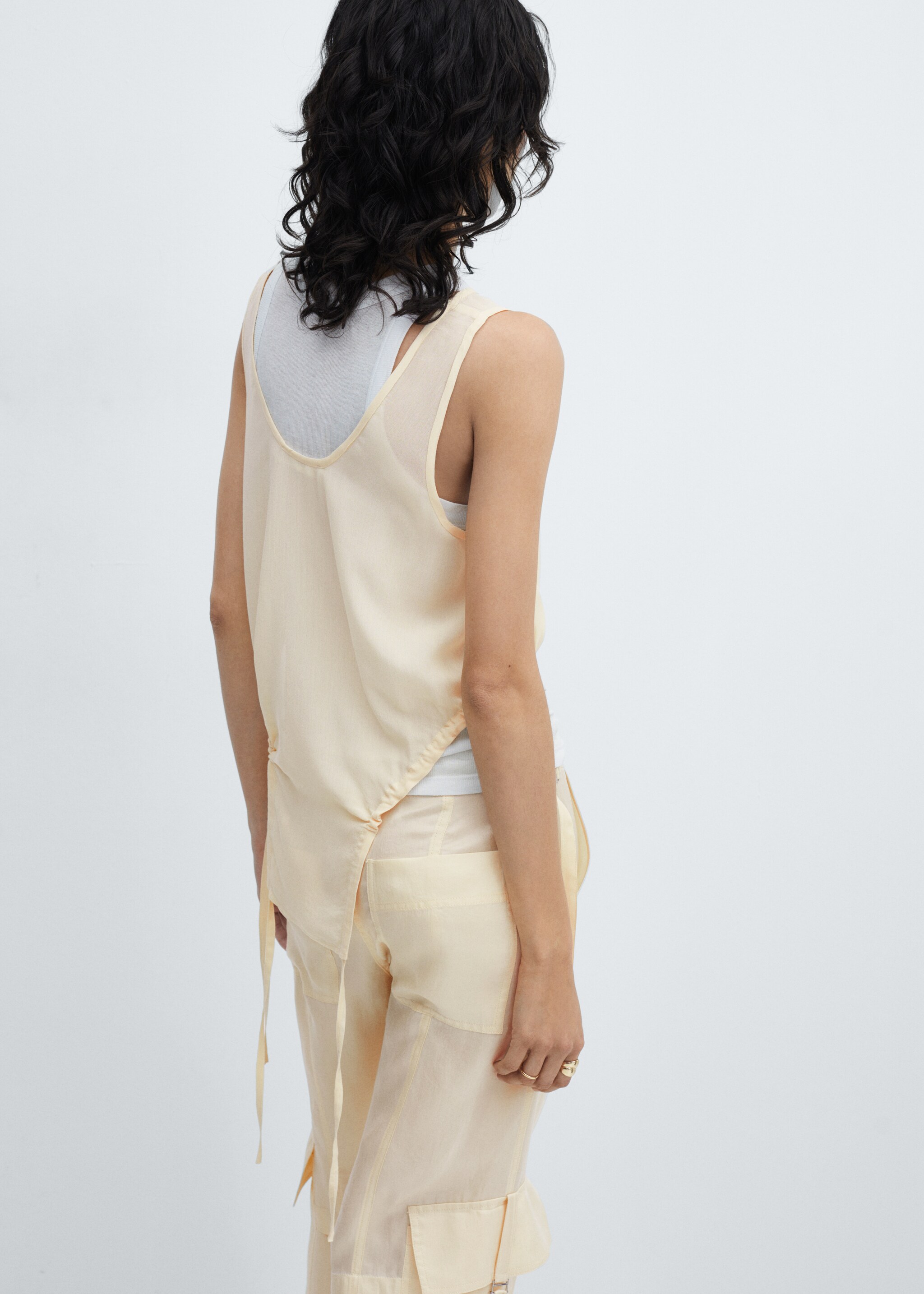 Semi-transparent top with side pleats - Reverse of the article