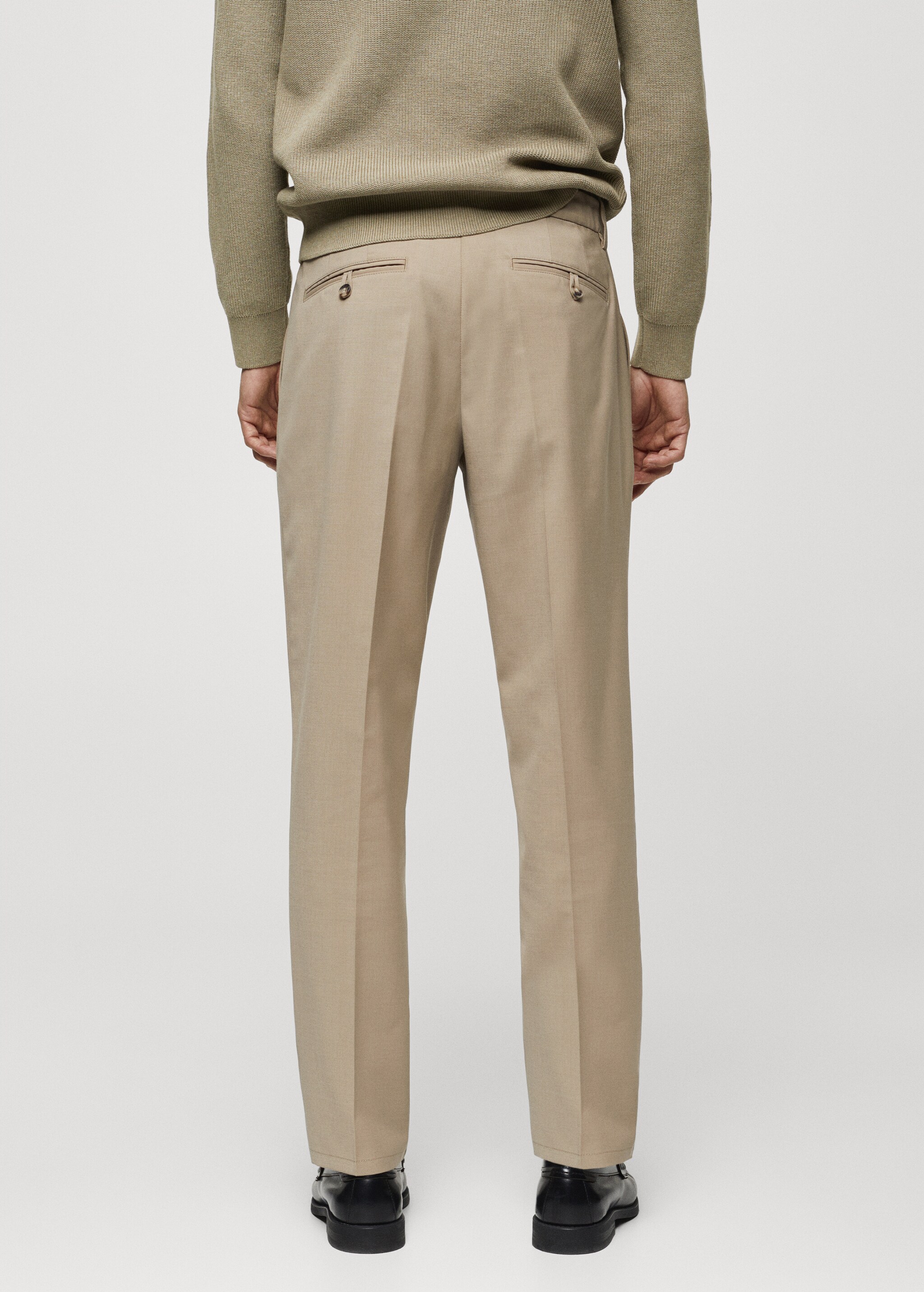 Cold wool trousers with pleat detail - Reverse of the article