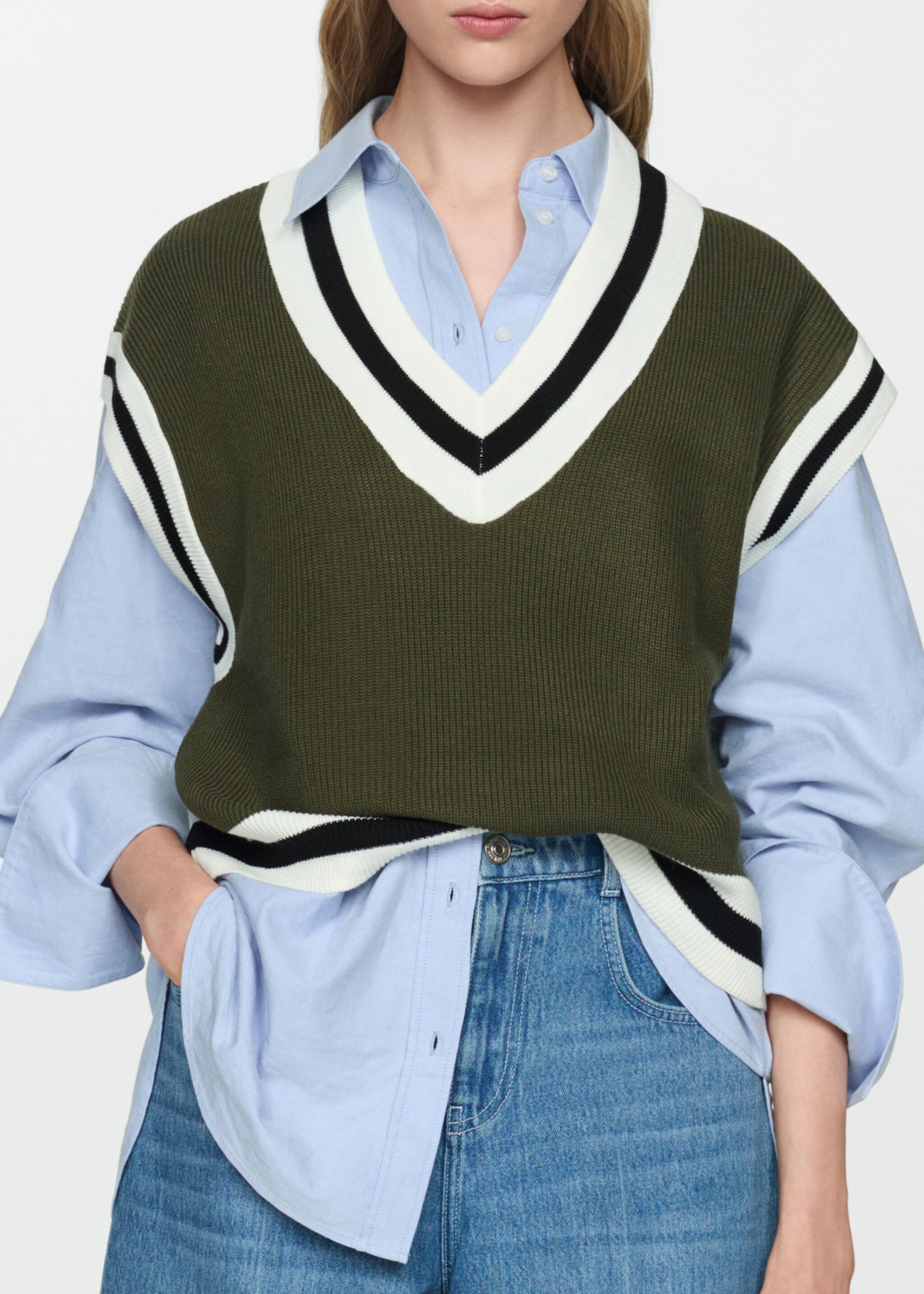 Gilet met contrasterende V-hals - Detail van het artikel 6