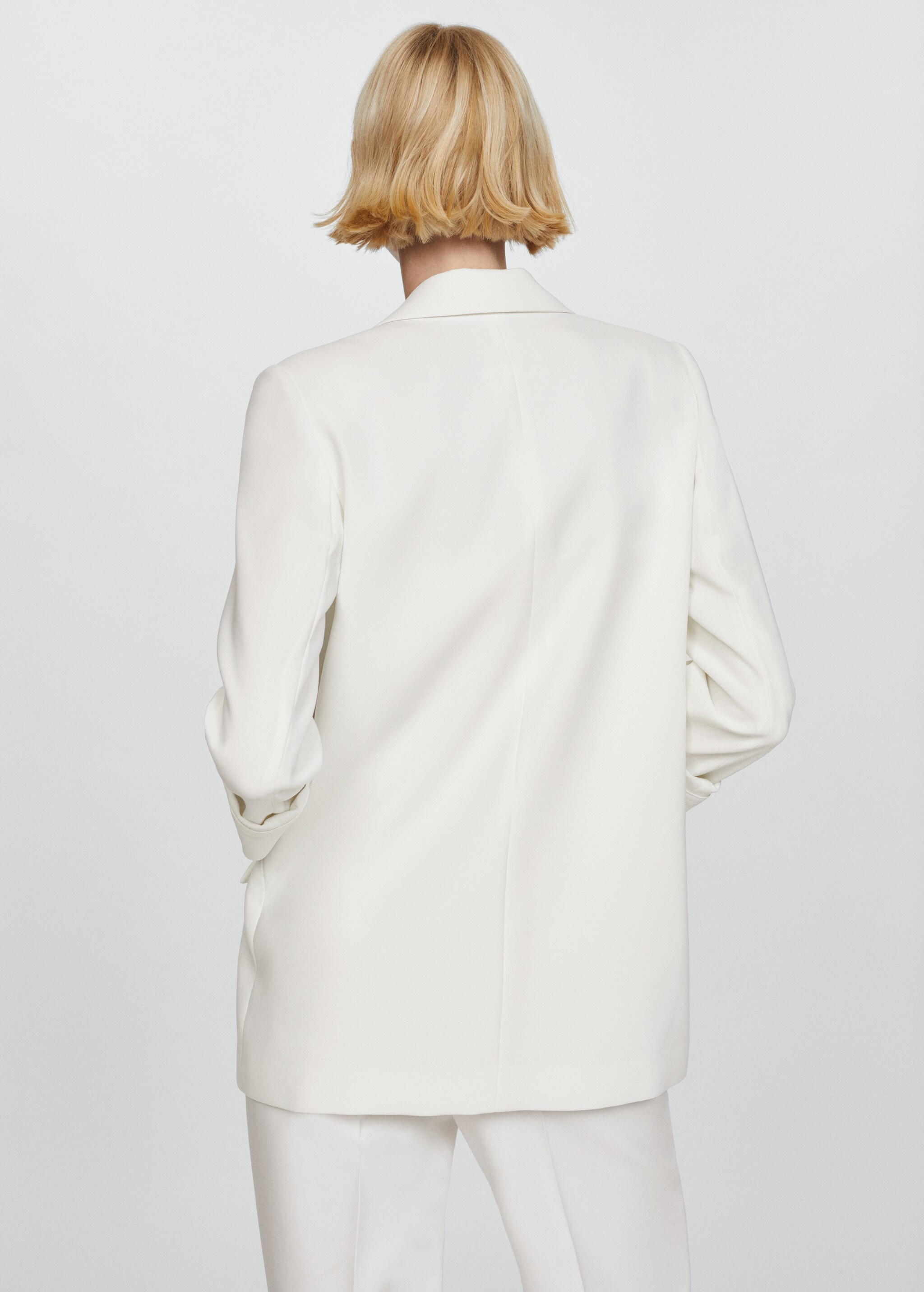 Tailored jacket with turn-down sleeves  - Reverse of the article