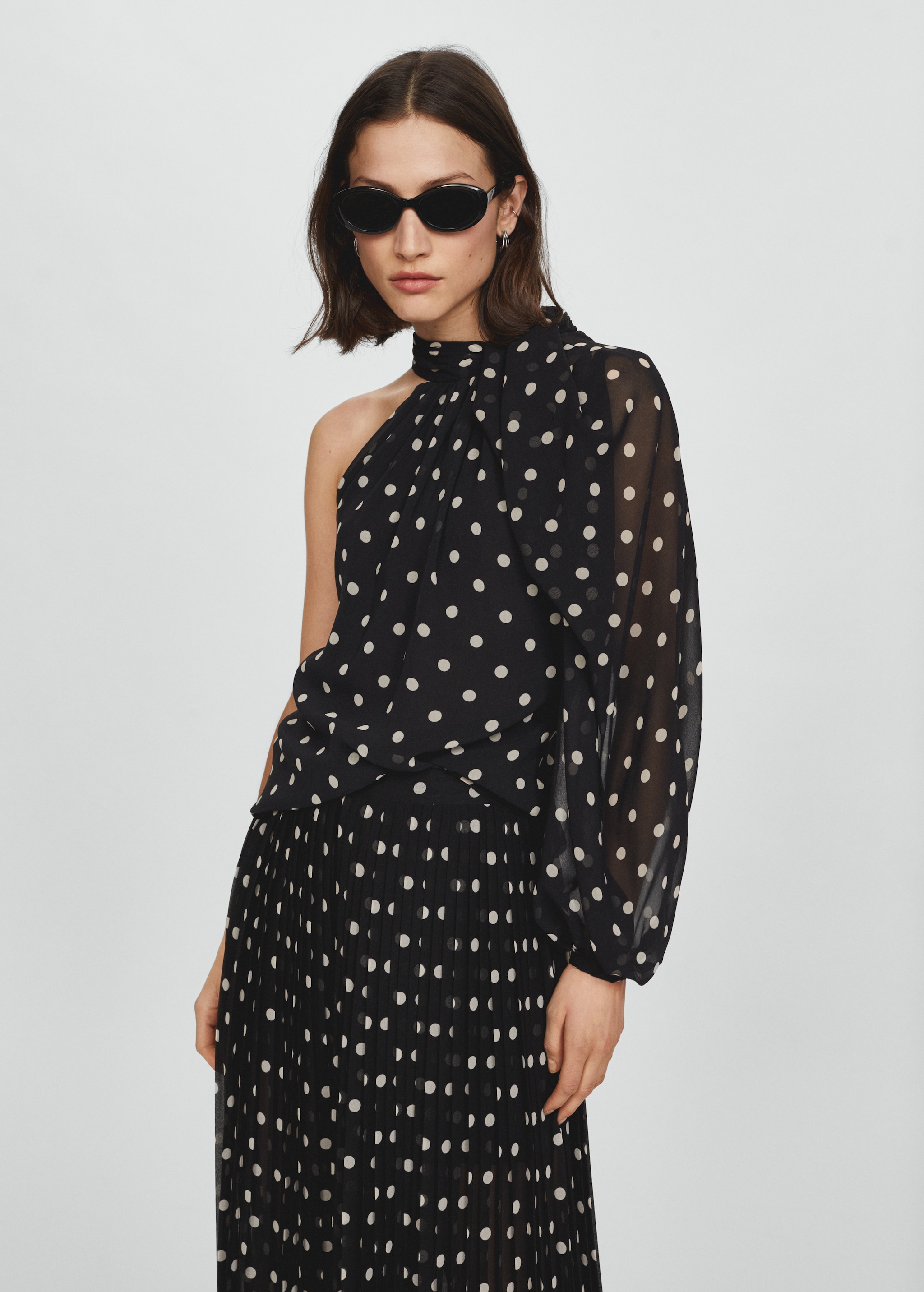 Asymmetric polka dot blouse