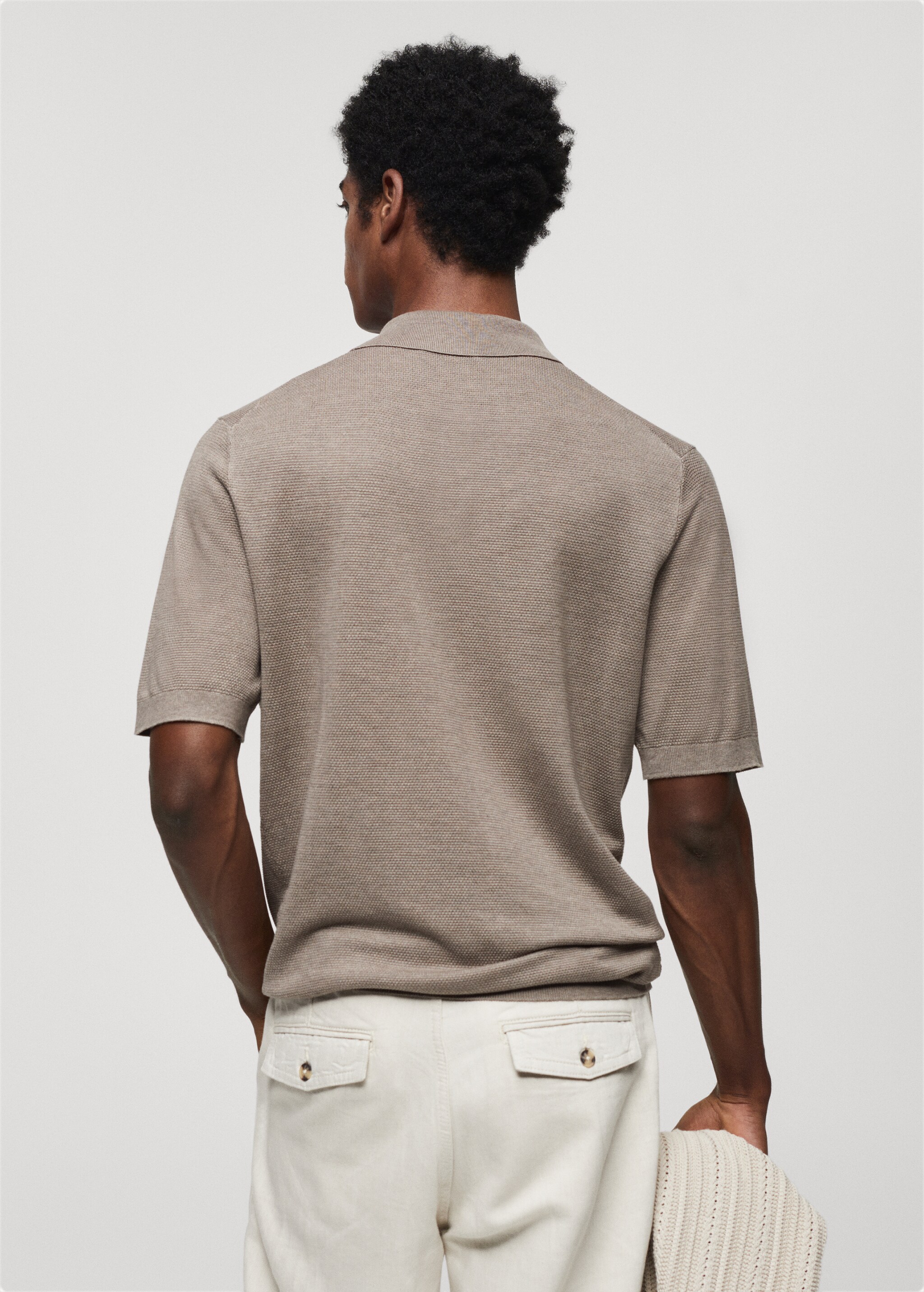 Buttoned micro-structure knitted polo shirt - Reverse of the article