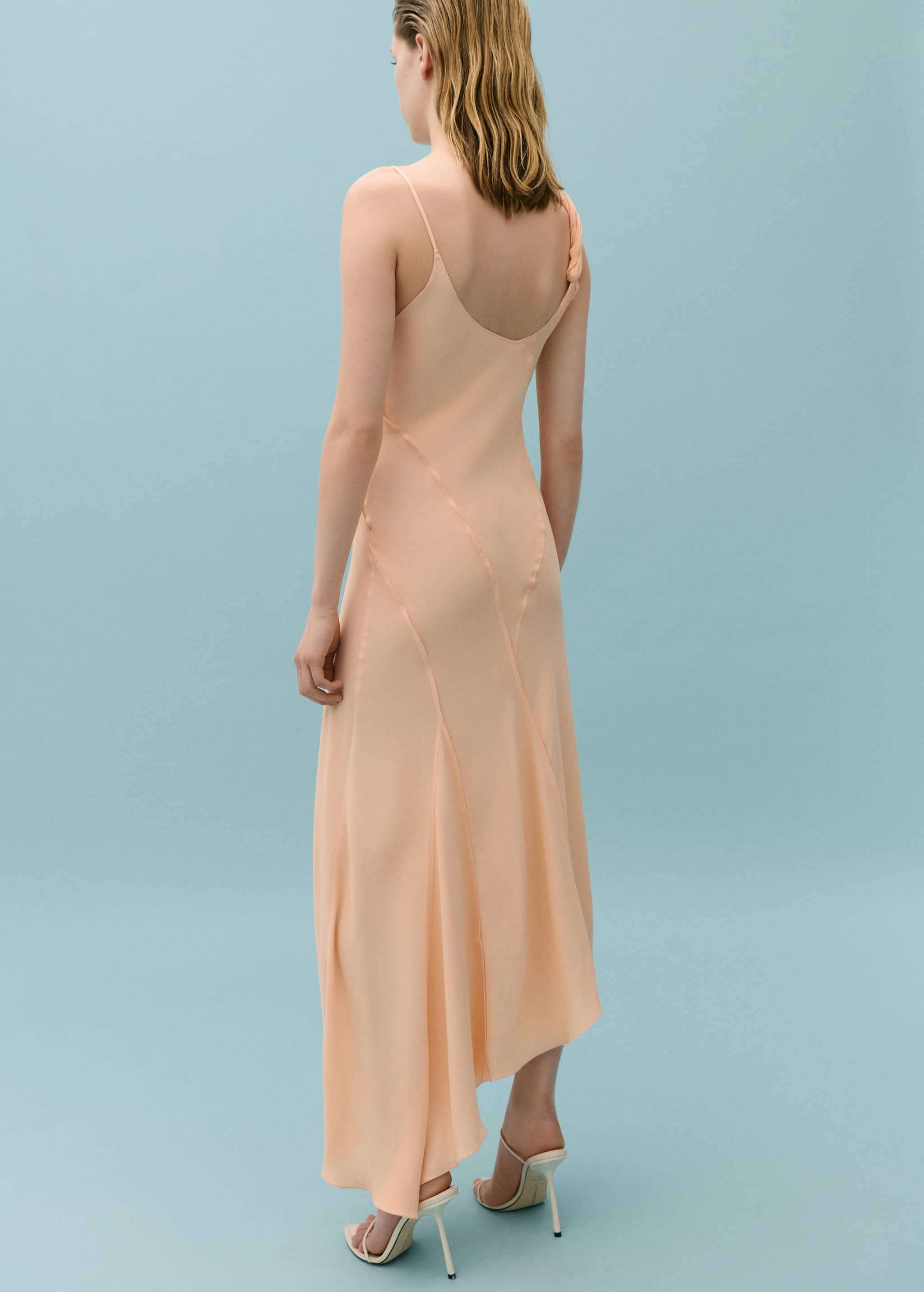 Asymmetrical dress with decorative stitching - Reverse of the article
