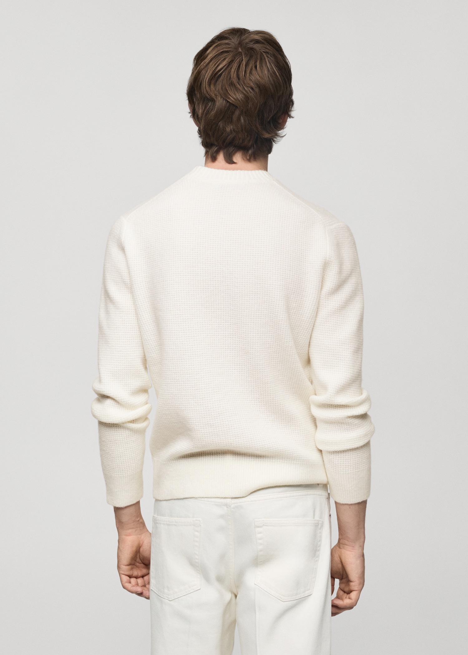 Knitted sweater with squared structure - Reverse of the article