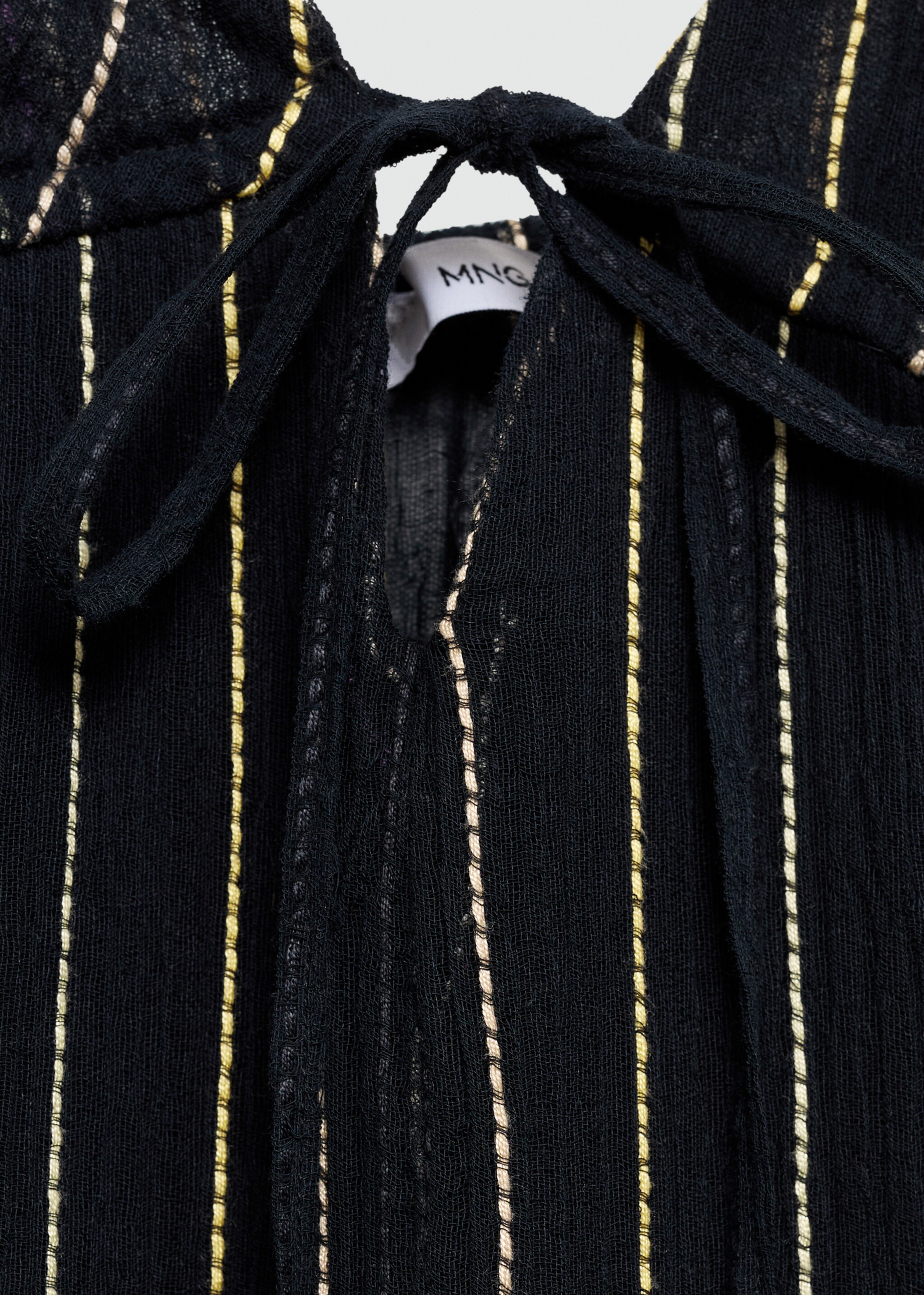 Strapless dress with decorative stitching - Details of the article 8, Black. Ref: 77010362-00.