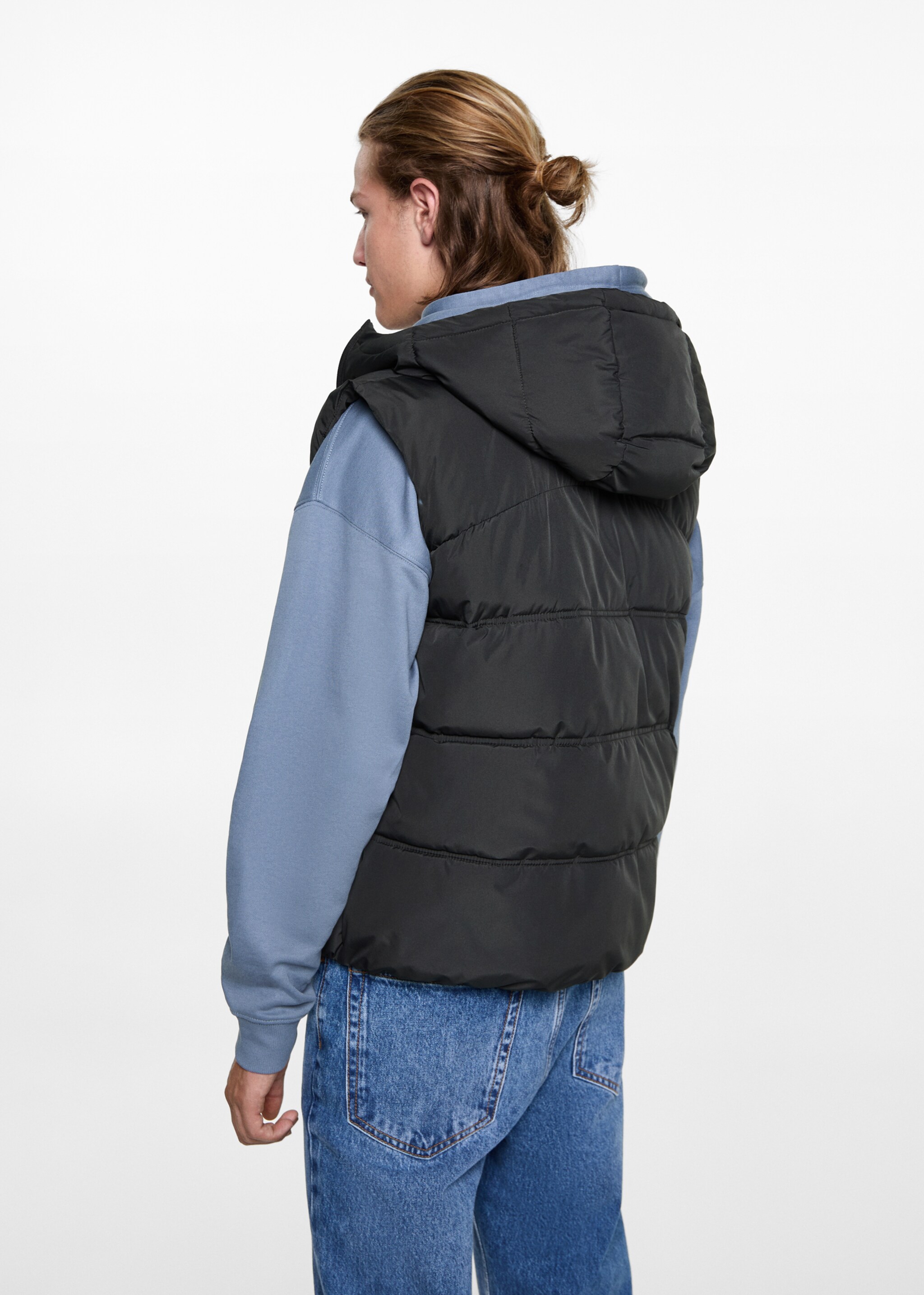 Quilted gilet with hood - Reverse of the article