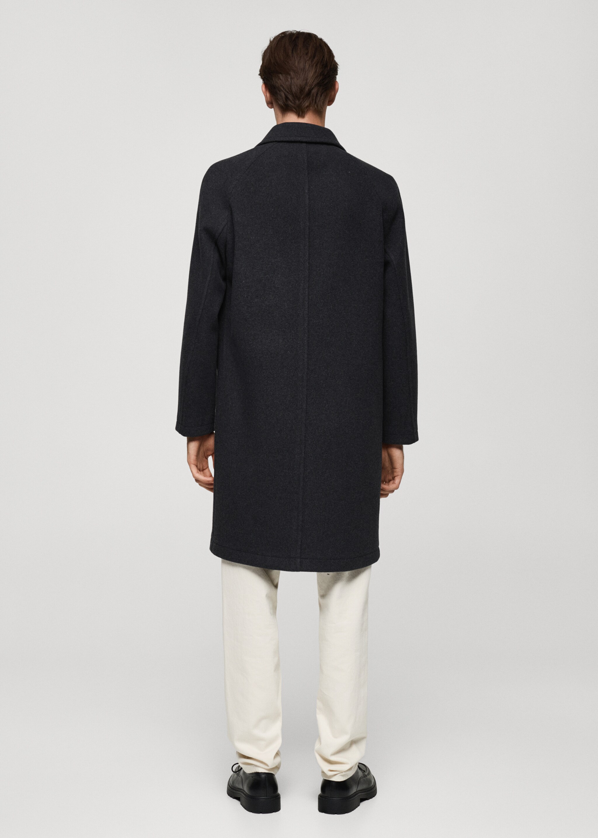 Pocketed wool coat - Reverse of the article