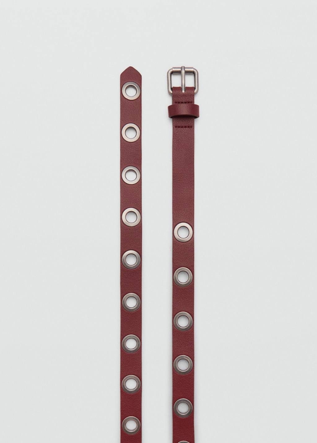 Belt with metal eyelets