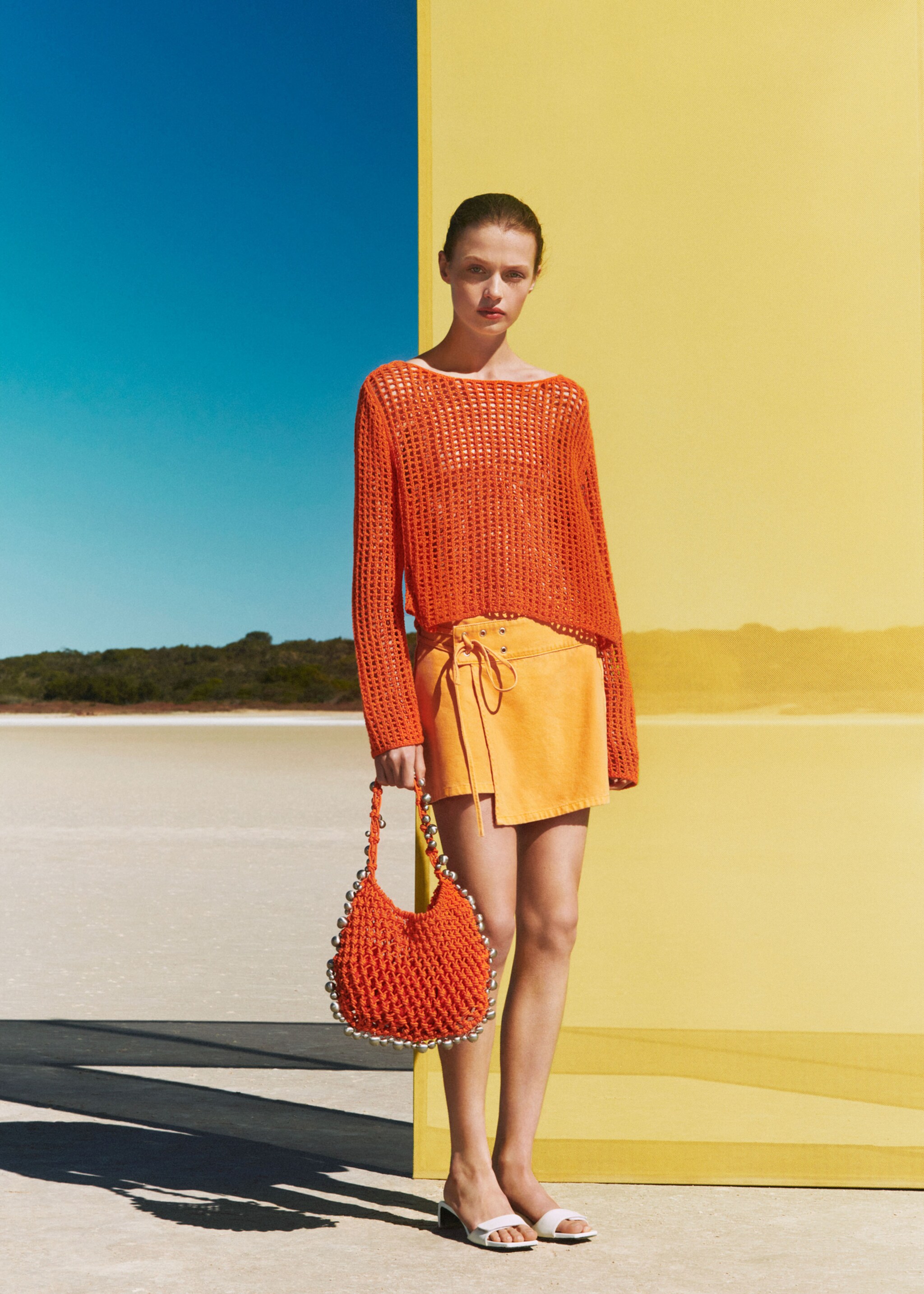 Crossed denim mini-skirt - Details of the article 6, Orange. Ref: 77050377-00.