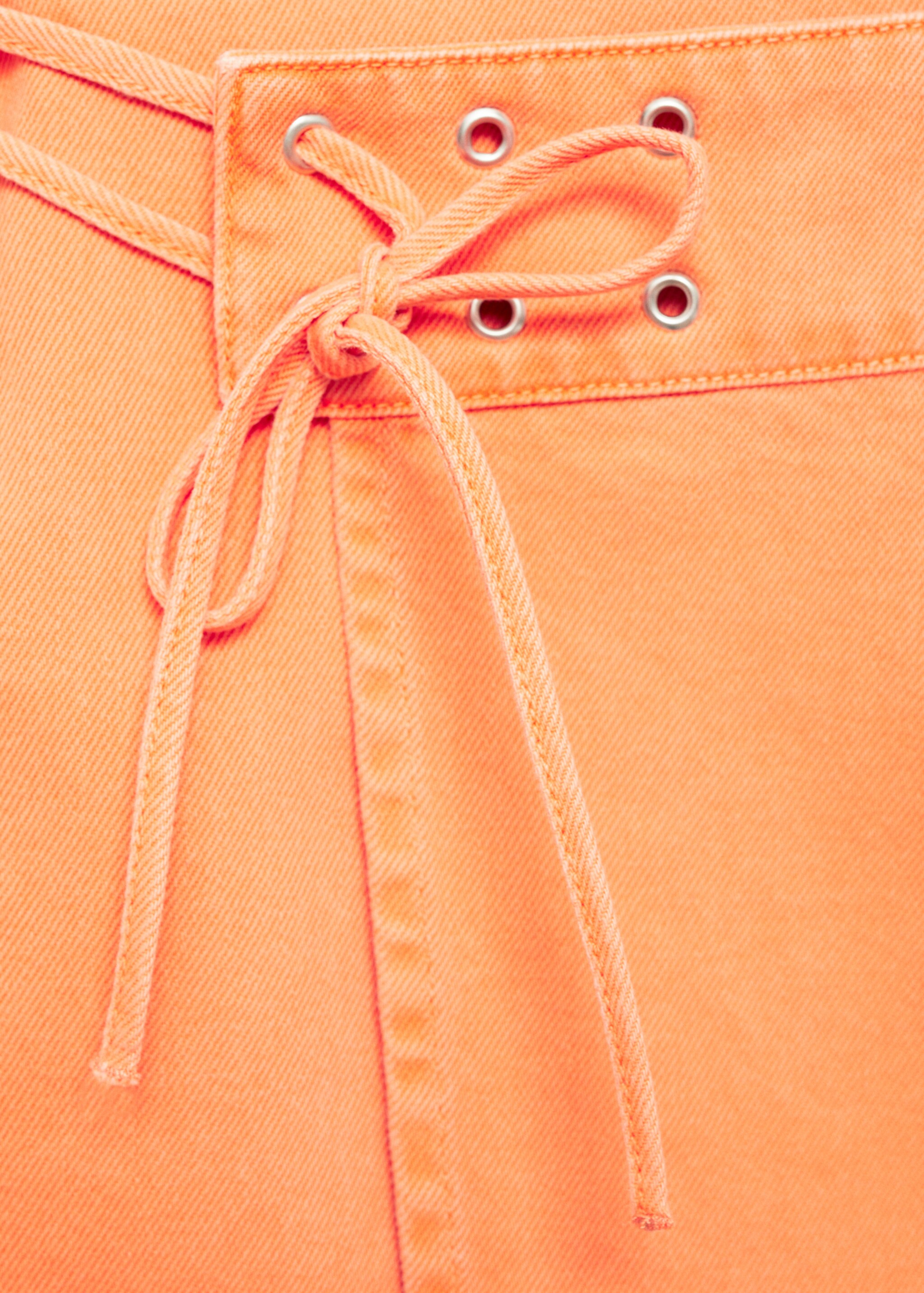 Crossed denim mini-skirt - Details of the article 8, Orange. Ref: 77050377-00.