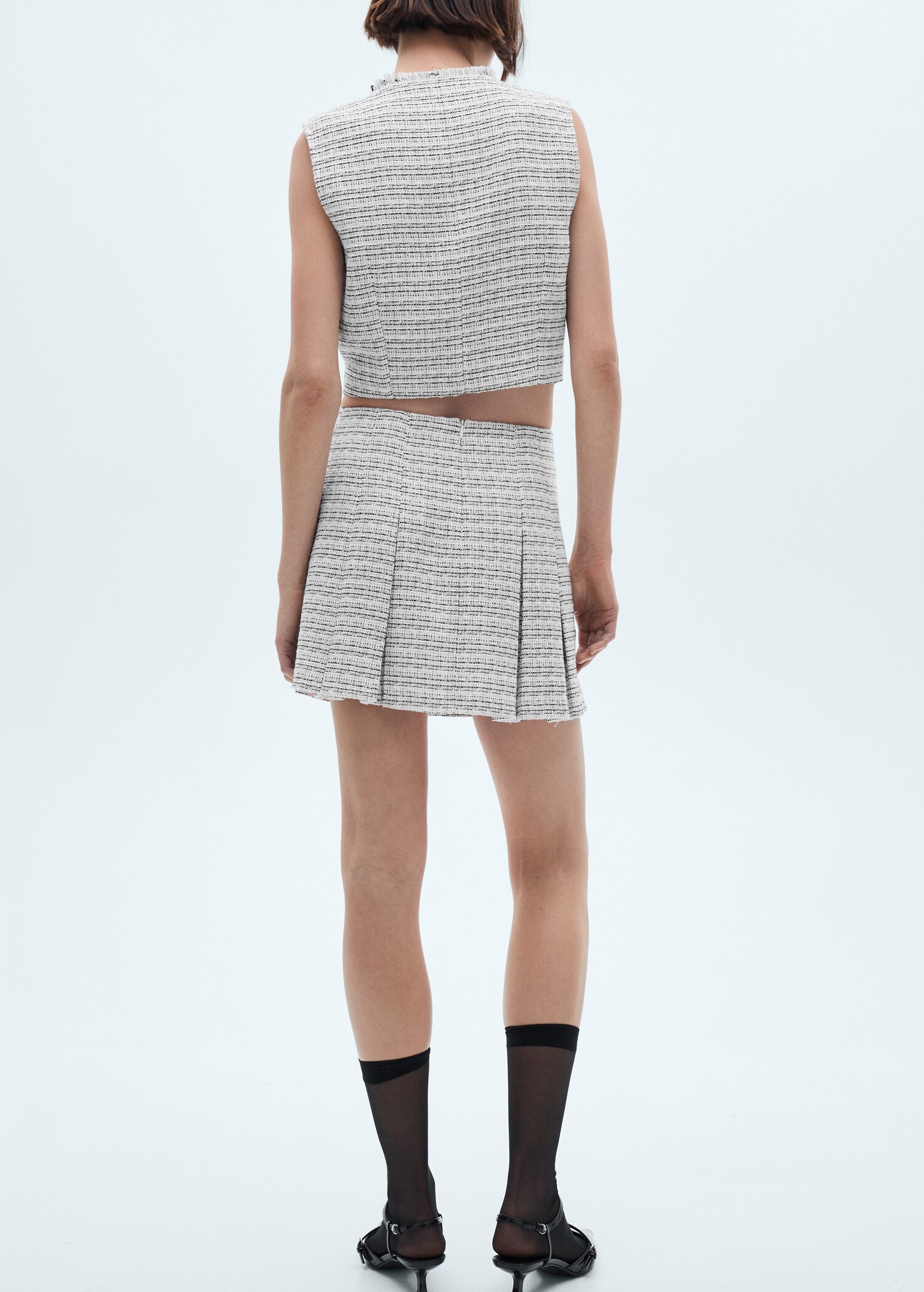 Tweed mini-skirt with buttons - Reverse of the article