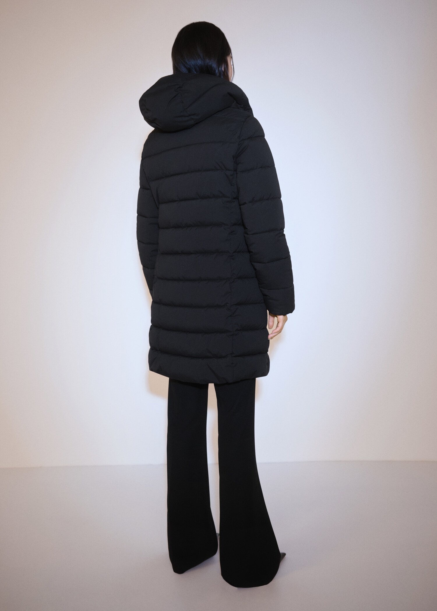 Hood quilted coat - Reverse of the article