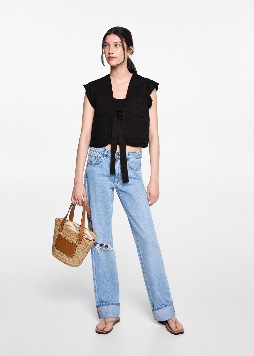 Quilted vest with pleat