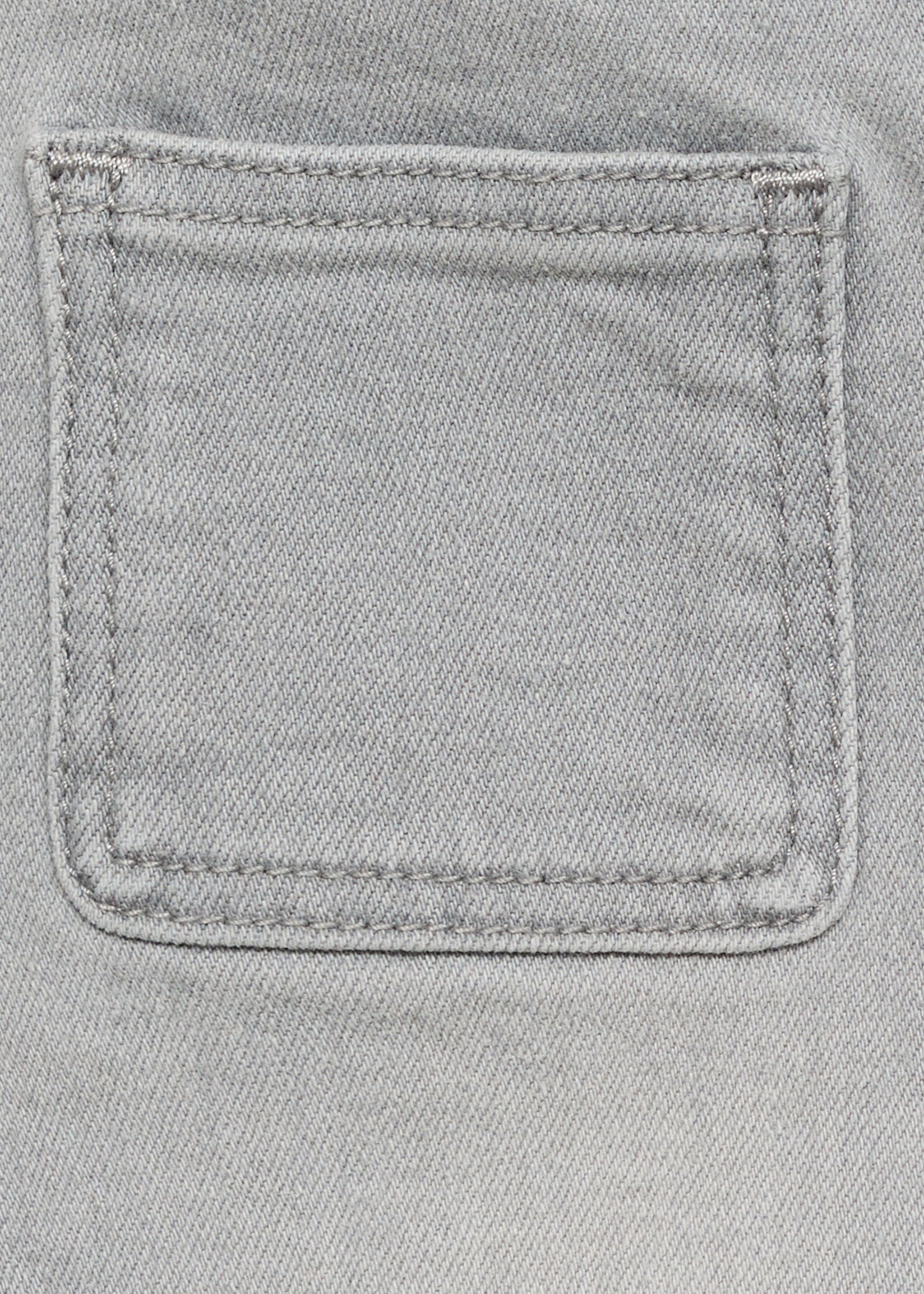 Flared jeans with pocket - Details of the article 0