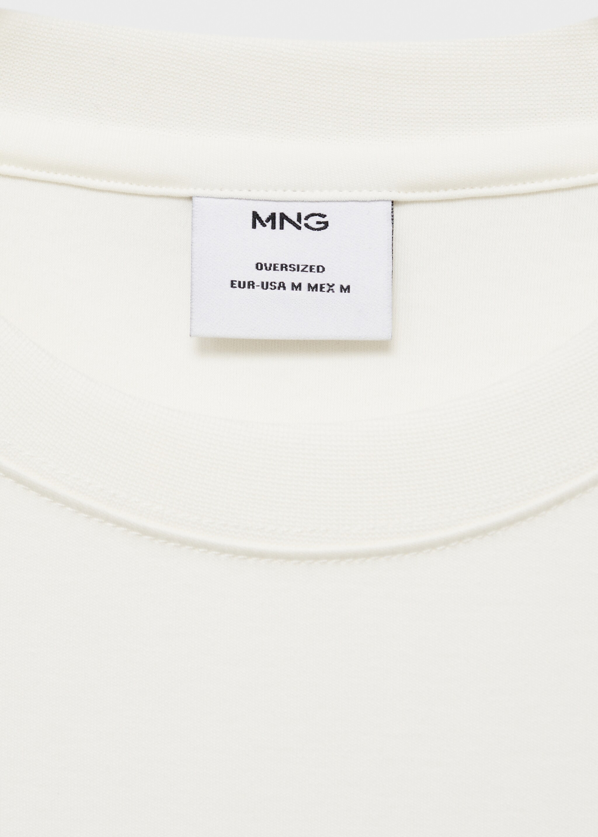 T-shirt med stor passform och ficka - Detaljer om artikeln 0