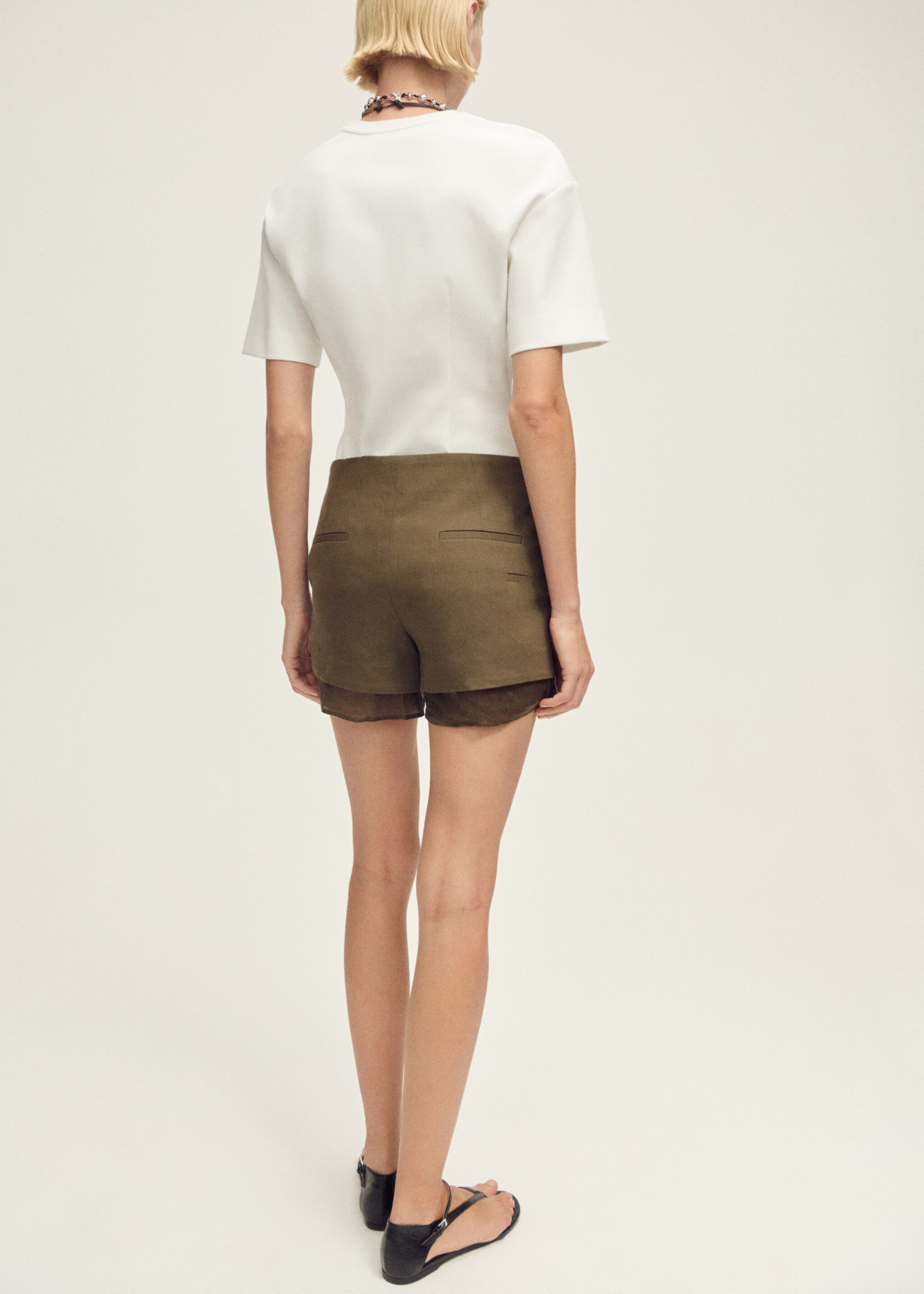 Short-sleeved peplum t-shirt - Reverse of the article