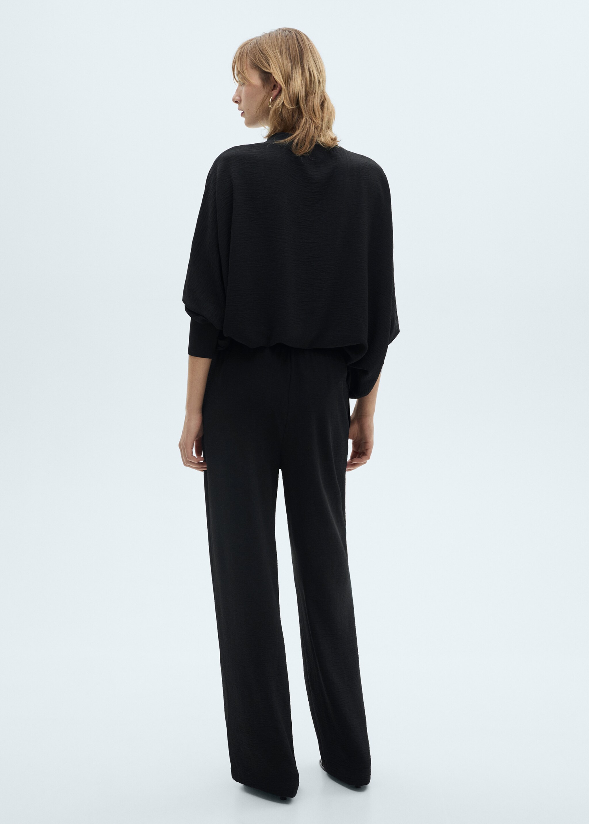 Straight knitted trousers - Reverse of the article