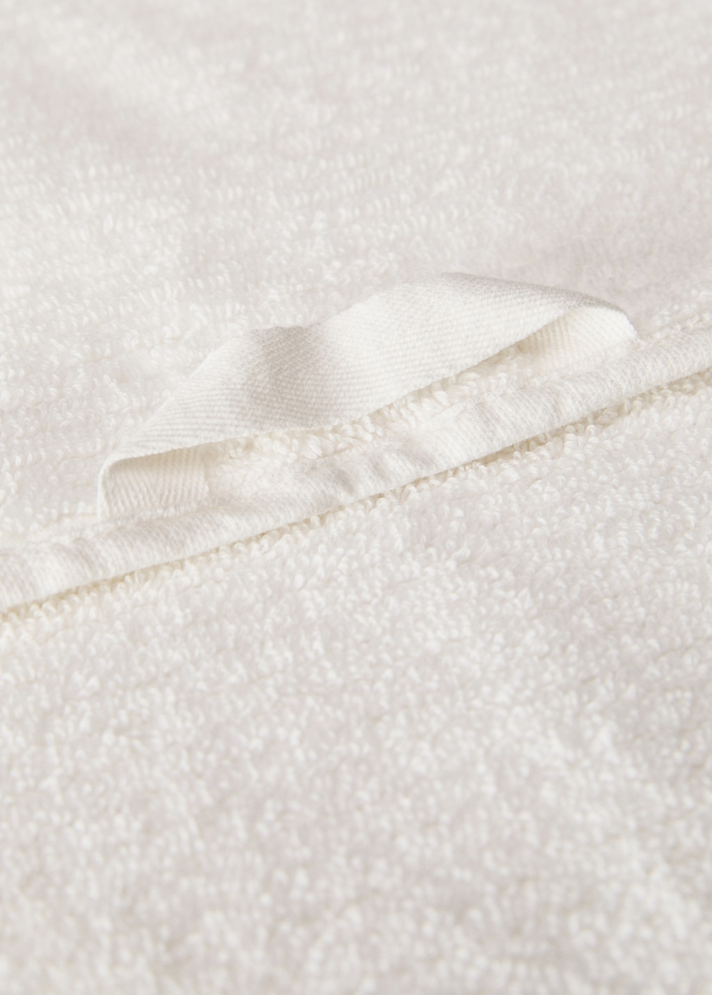 Stripe-embossed washbasin towel with fringes