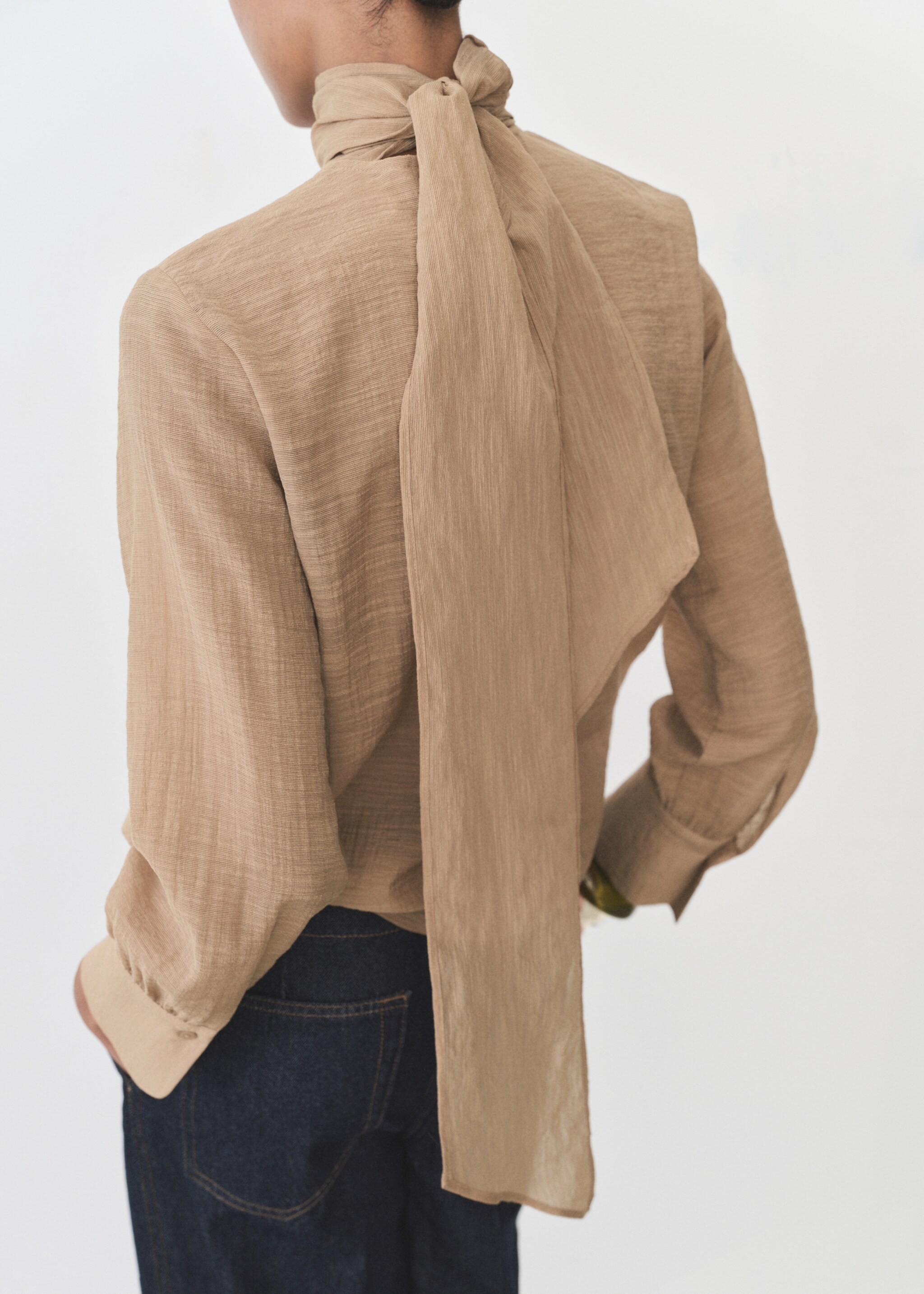 Textured blouse with bow - Reverse of the article