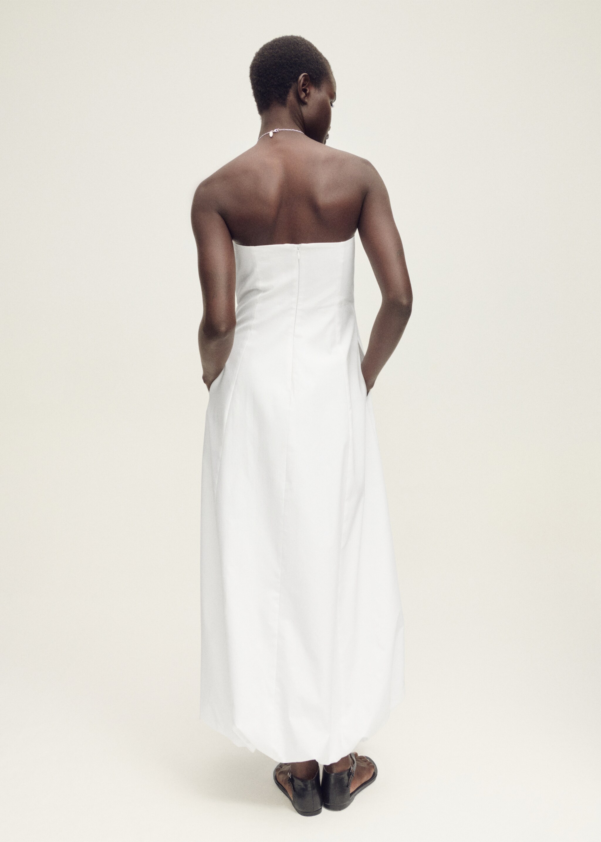 Strapless dress with puffed hem - Reverse of the article