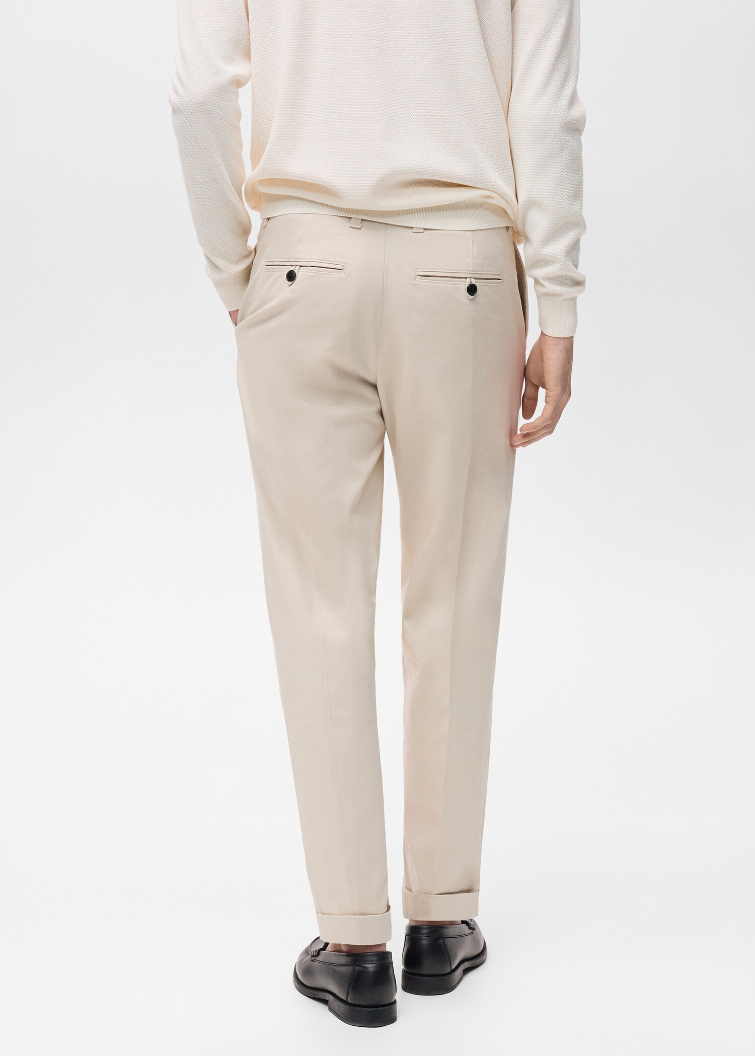 Pleated pants under cuff - Reverse of the article