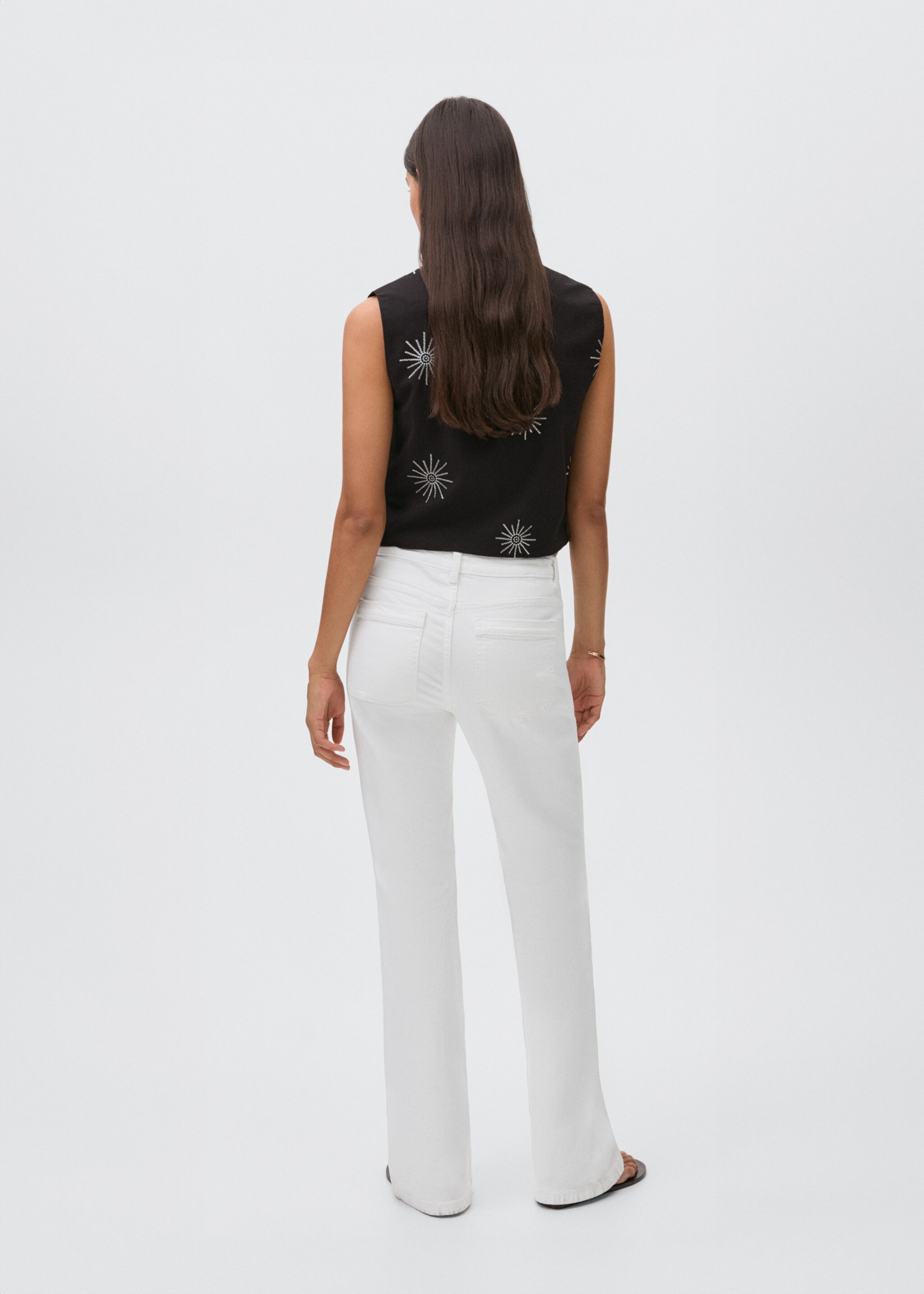 Flared jeans with pocket - Reverse of the article