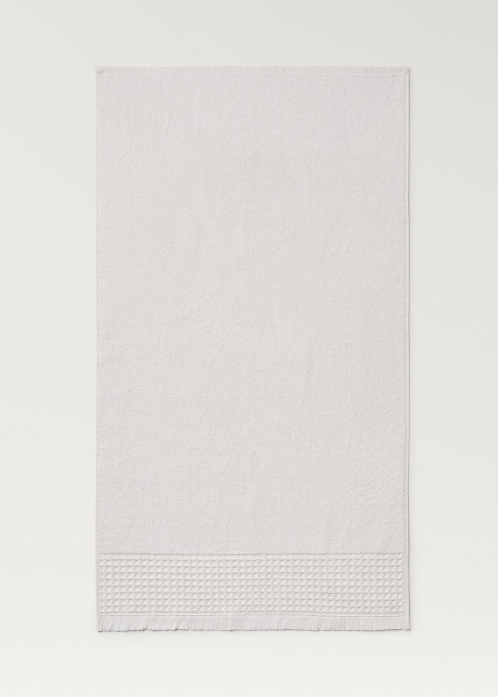 Bath towel with waffle trim and fringe