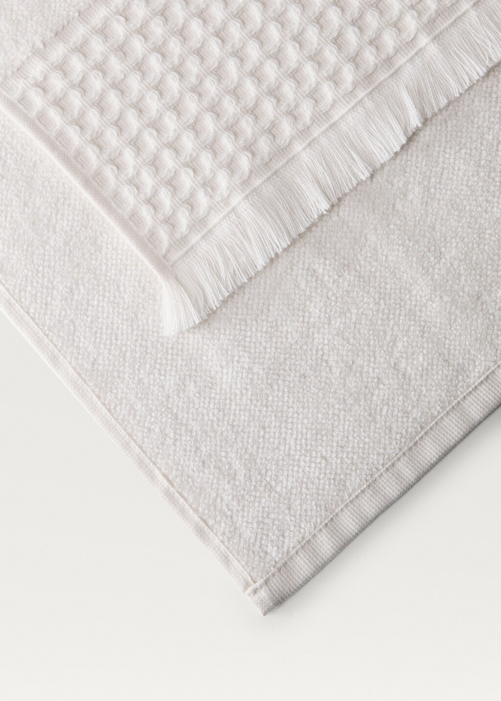 Hand towel with waffle trim and fringe