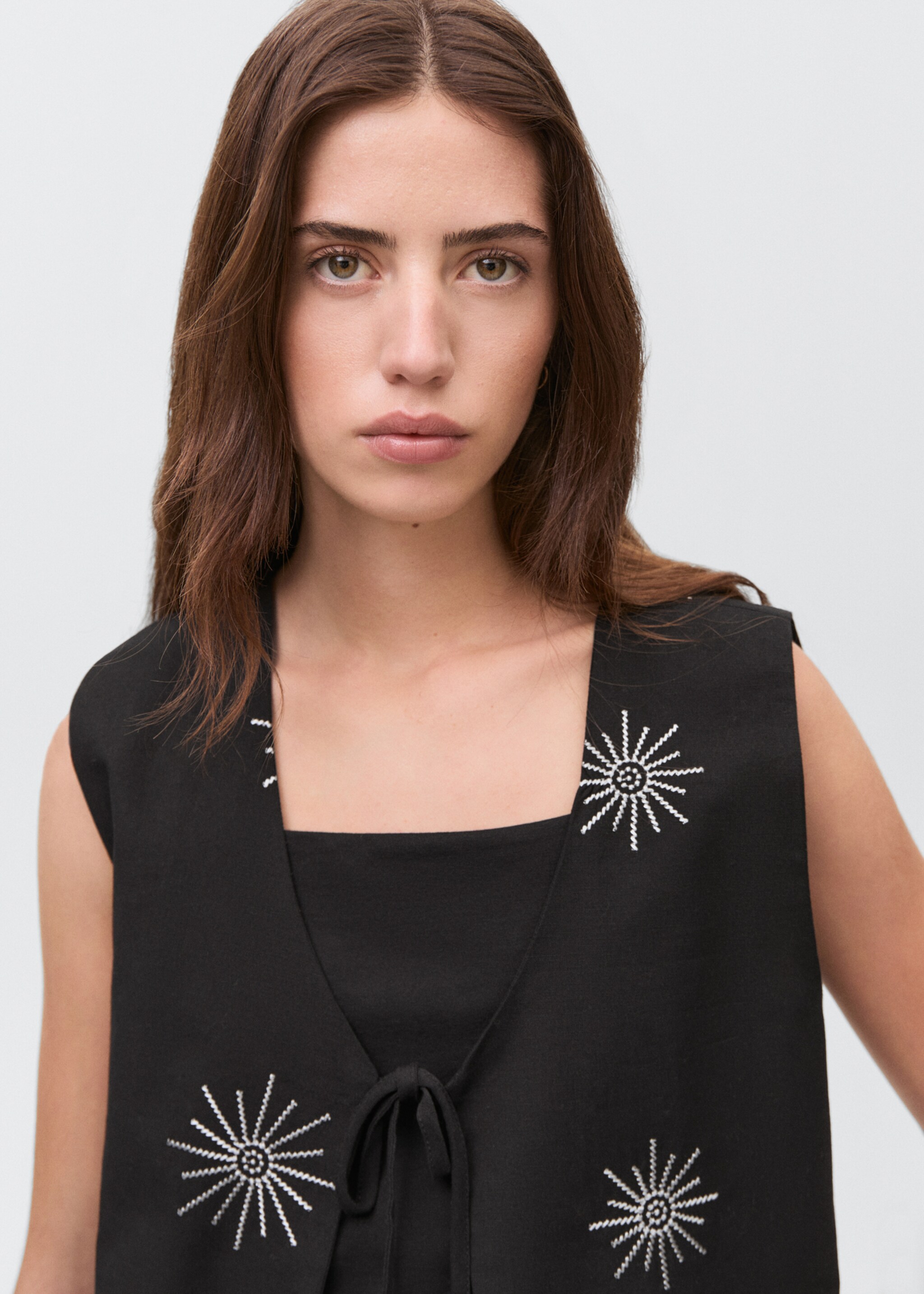 Embroidered top with bow closure - Details of the article 1
