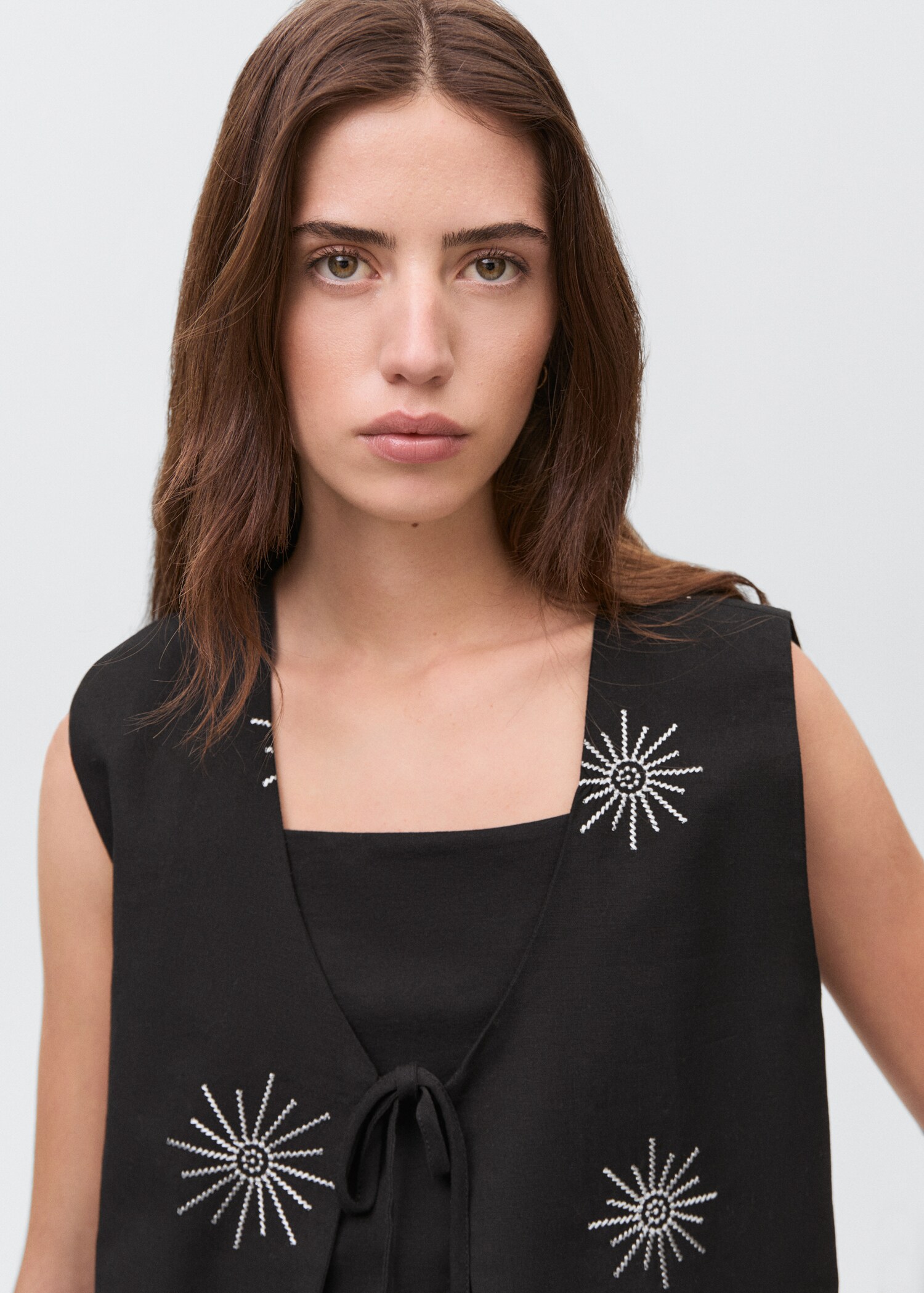 Embroidered top with bow closure - Details of the article 1