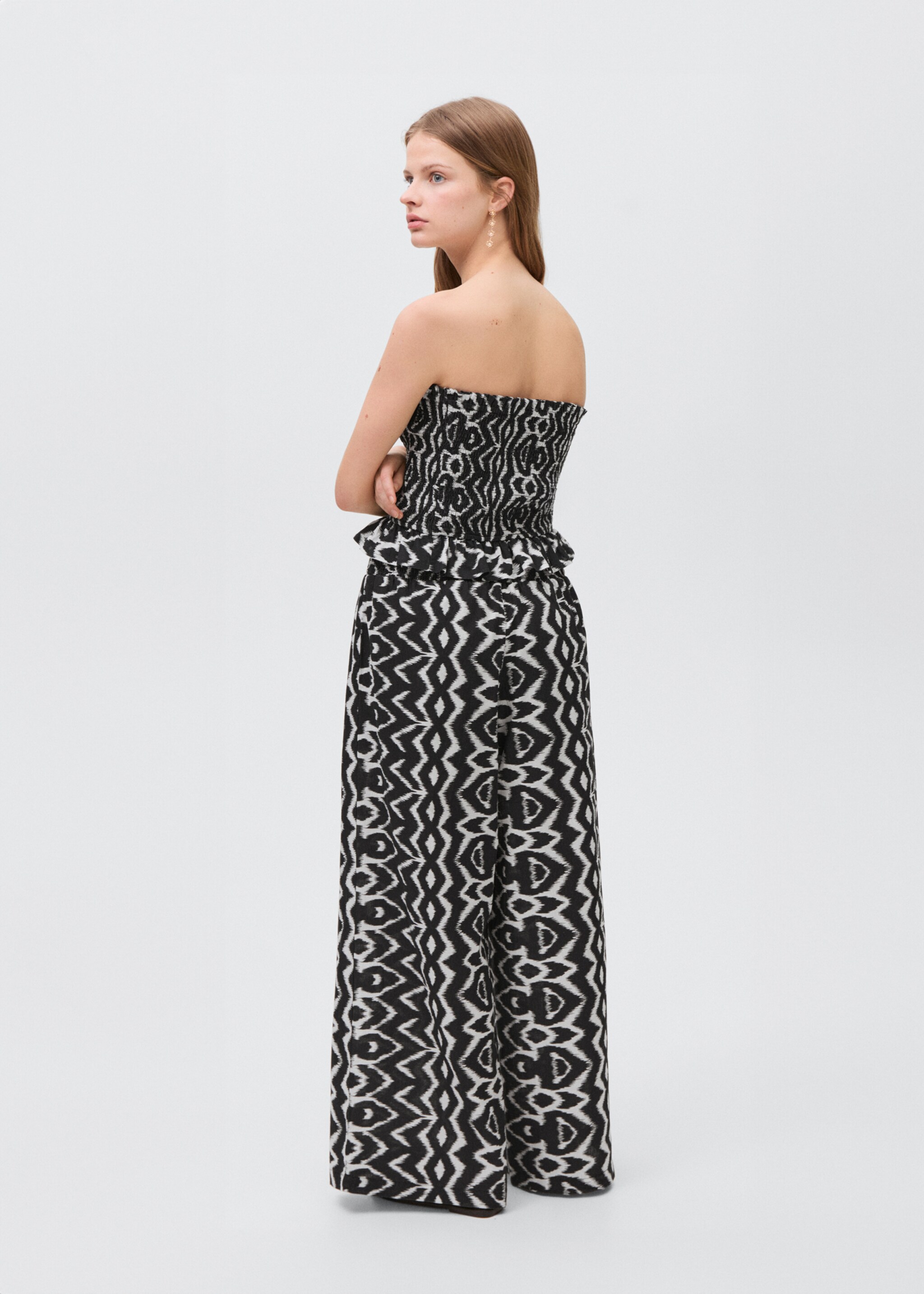Strapless top with ruffles - Reverse of the article