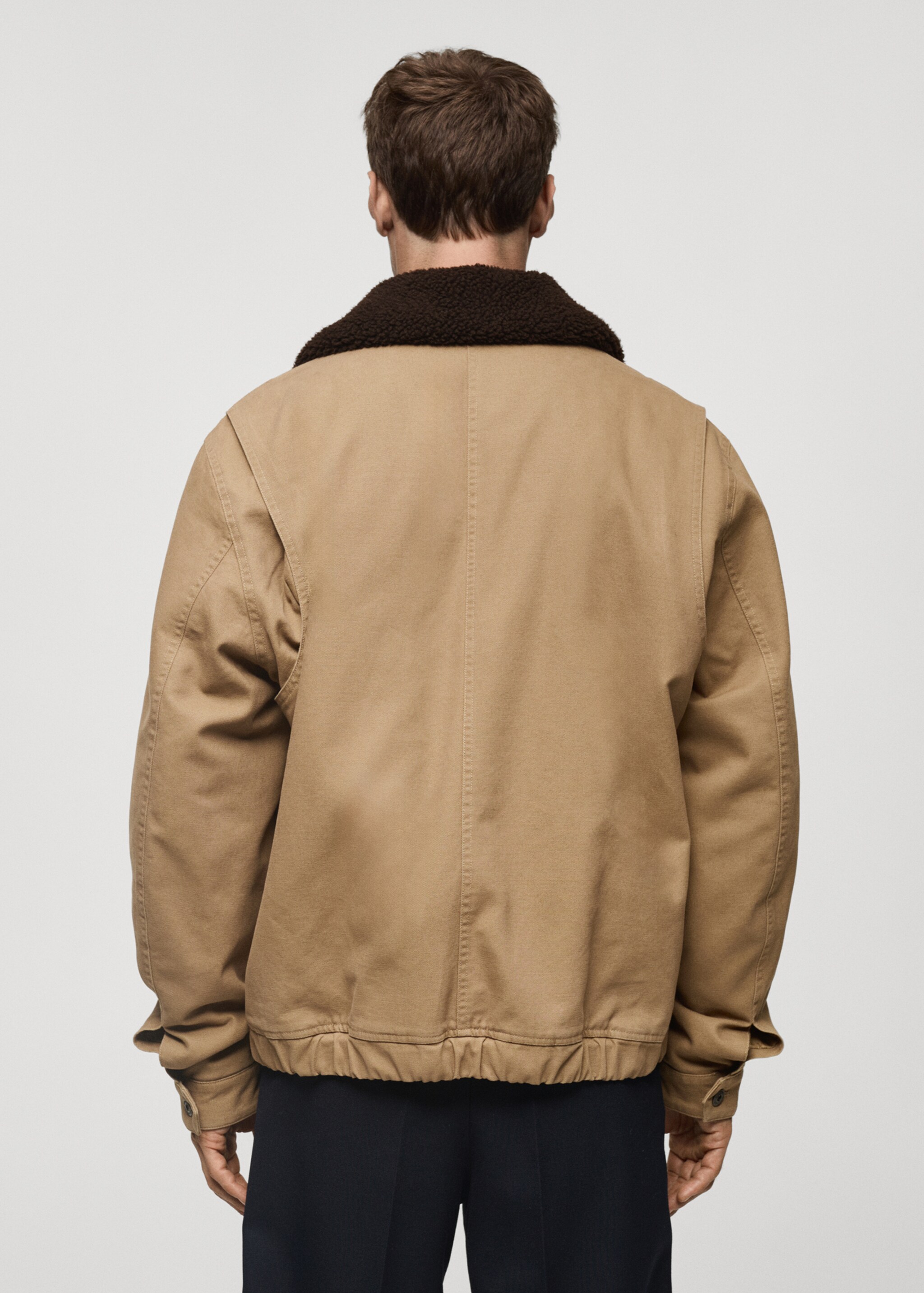 Quilted jacket with sheepskin collar - Reverse of the article