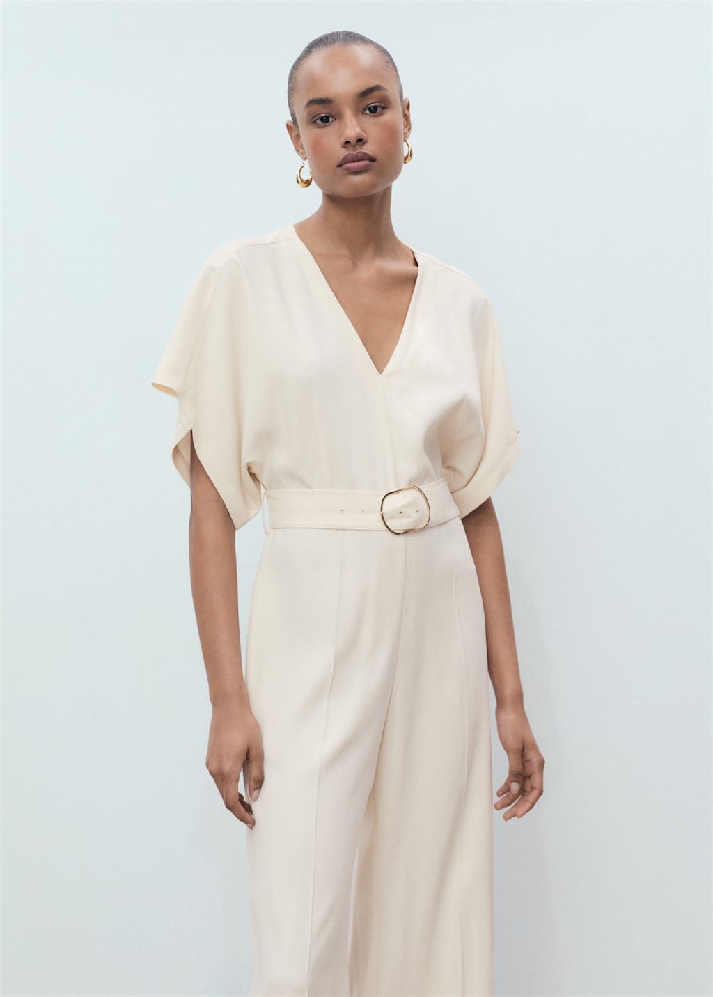 Long jumpsuit with belt and buckle