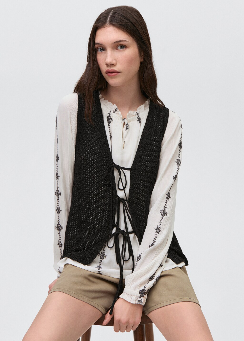 Knitted vest with lace pattern