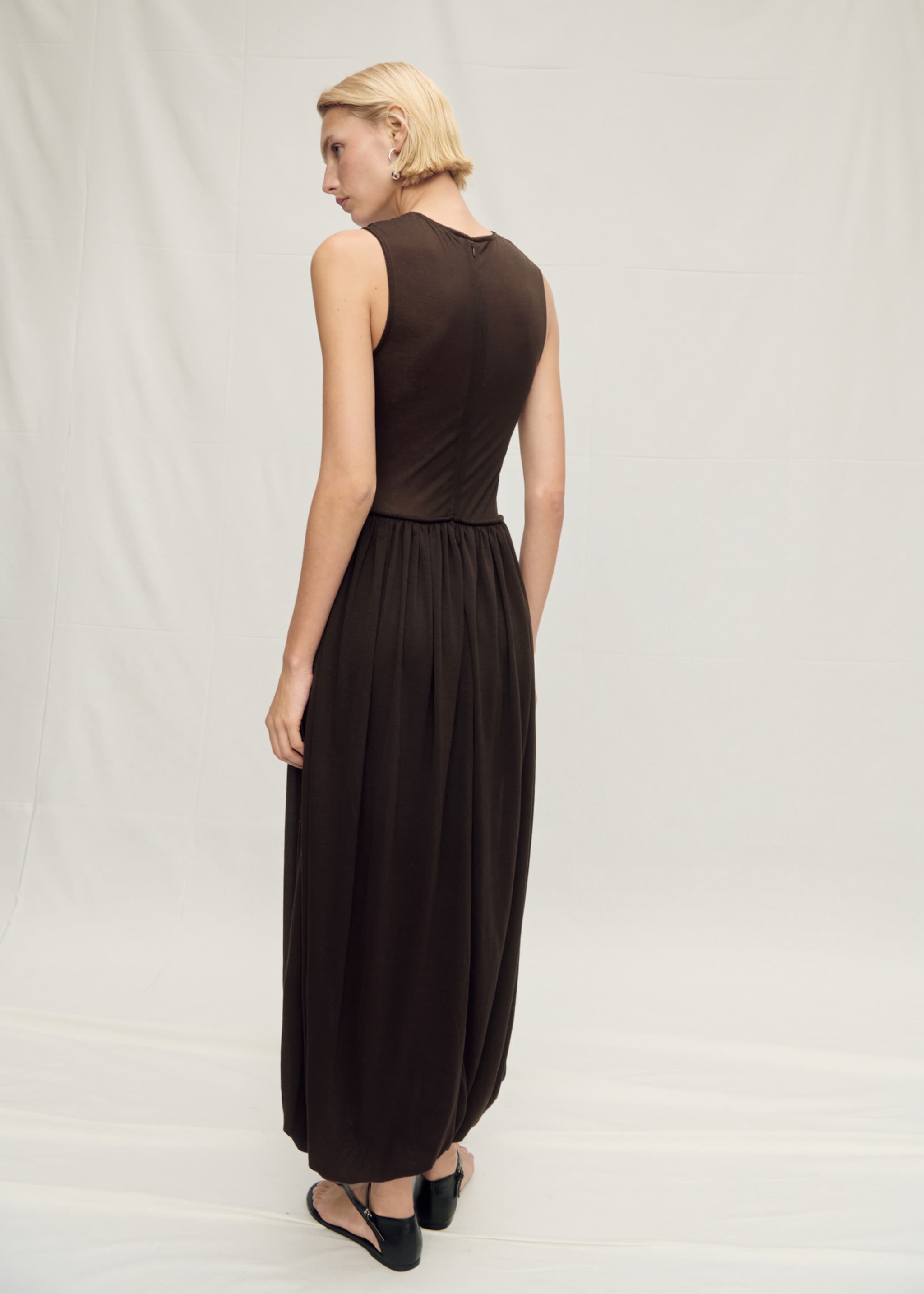 Semi-transparent dress with puffed hem - Reverse of the article