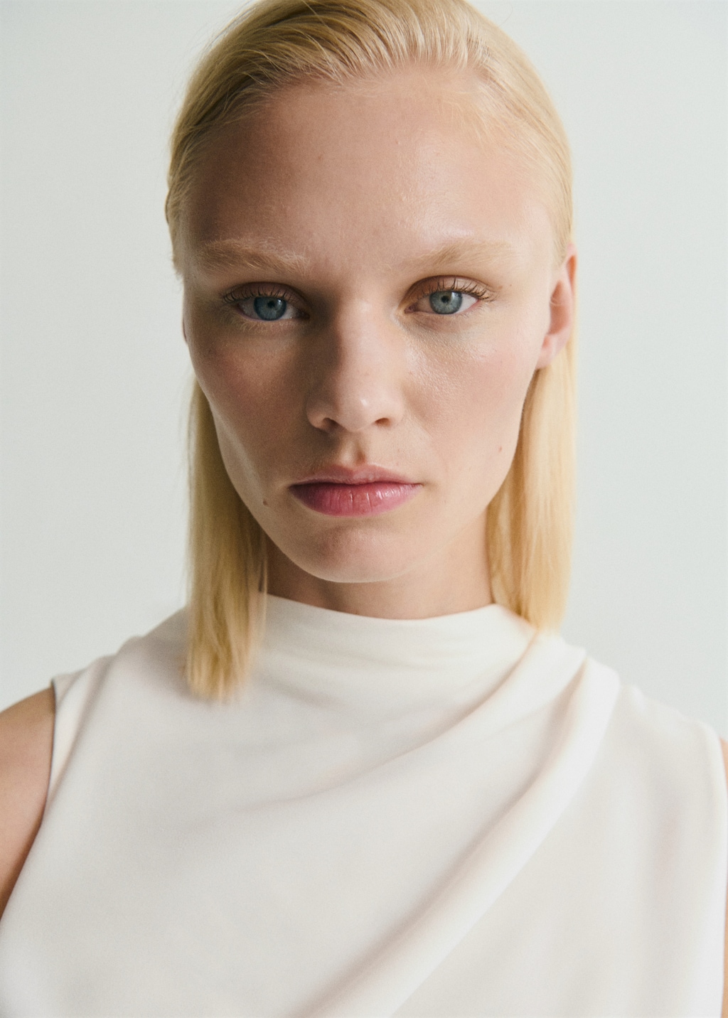 Long jumpsuit with draped neck and belt