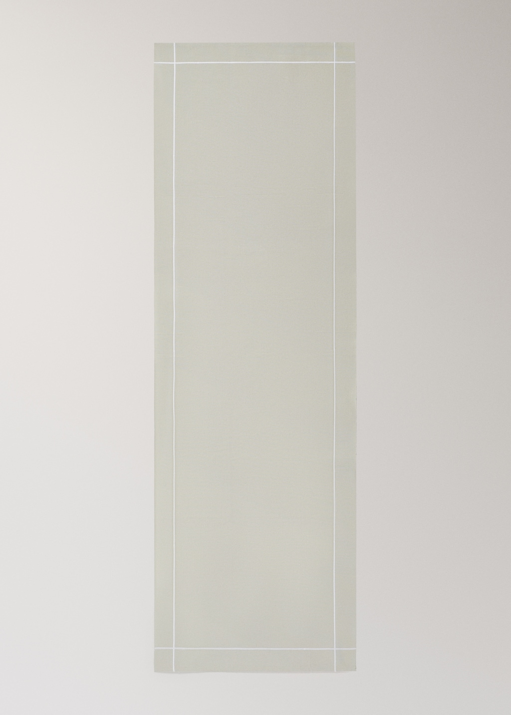 Cotton embroidered table runner with scalloped detail