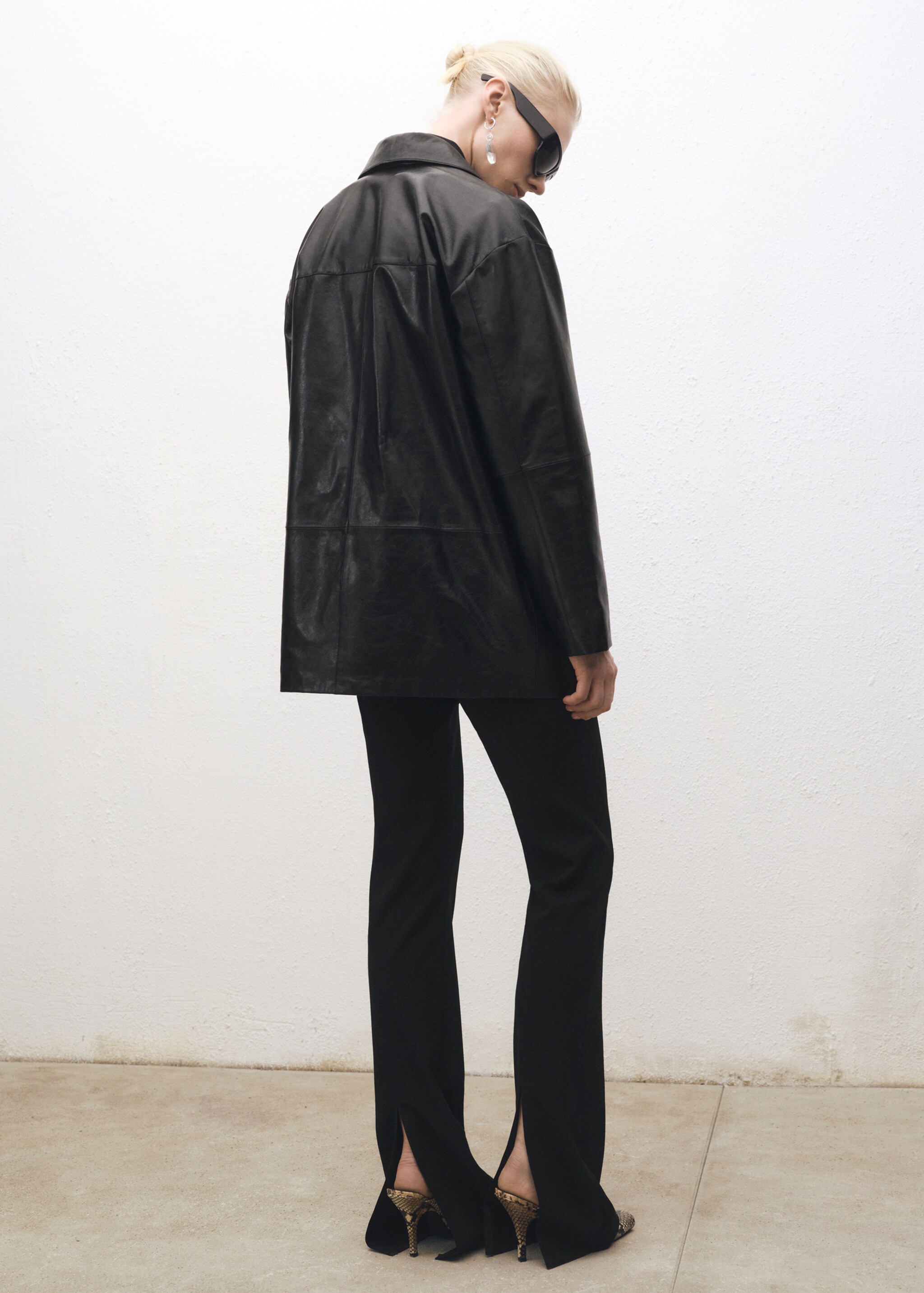 Flared suit trousers with openings - Reverse of the article