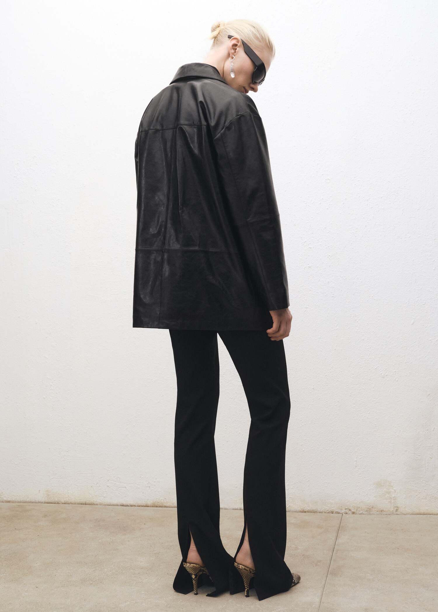 Flared suit trousers with openings - Reverse of the article
