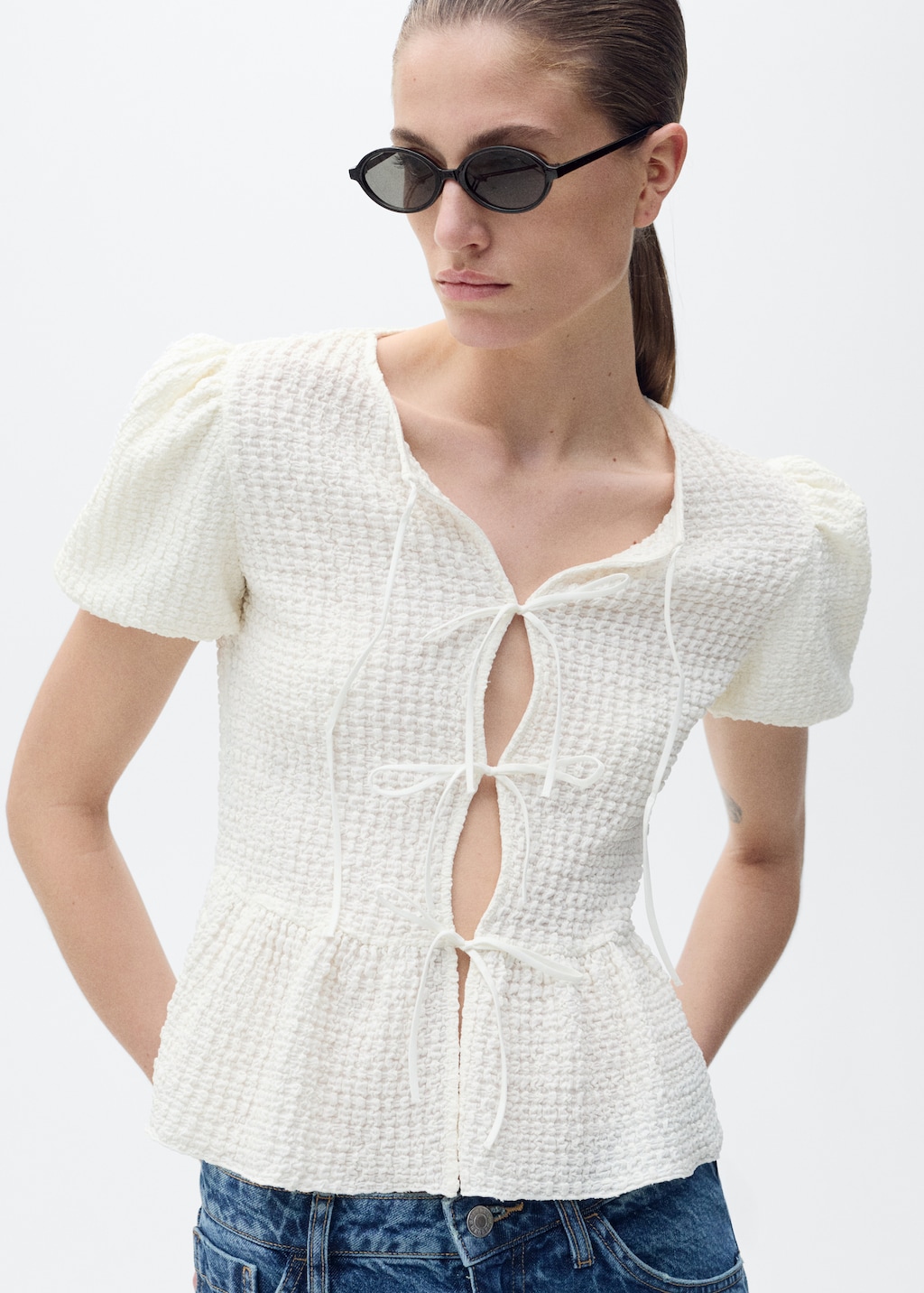 Textured blouse with bow closure
