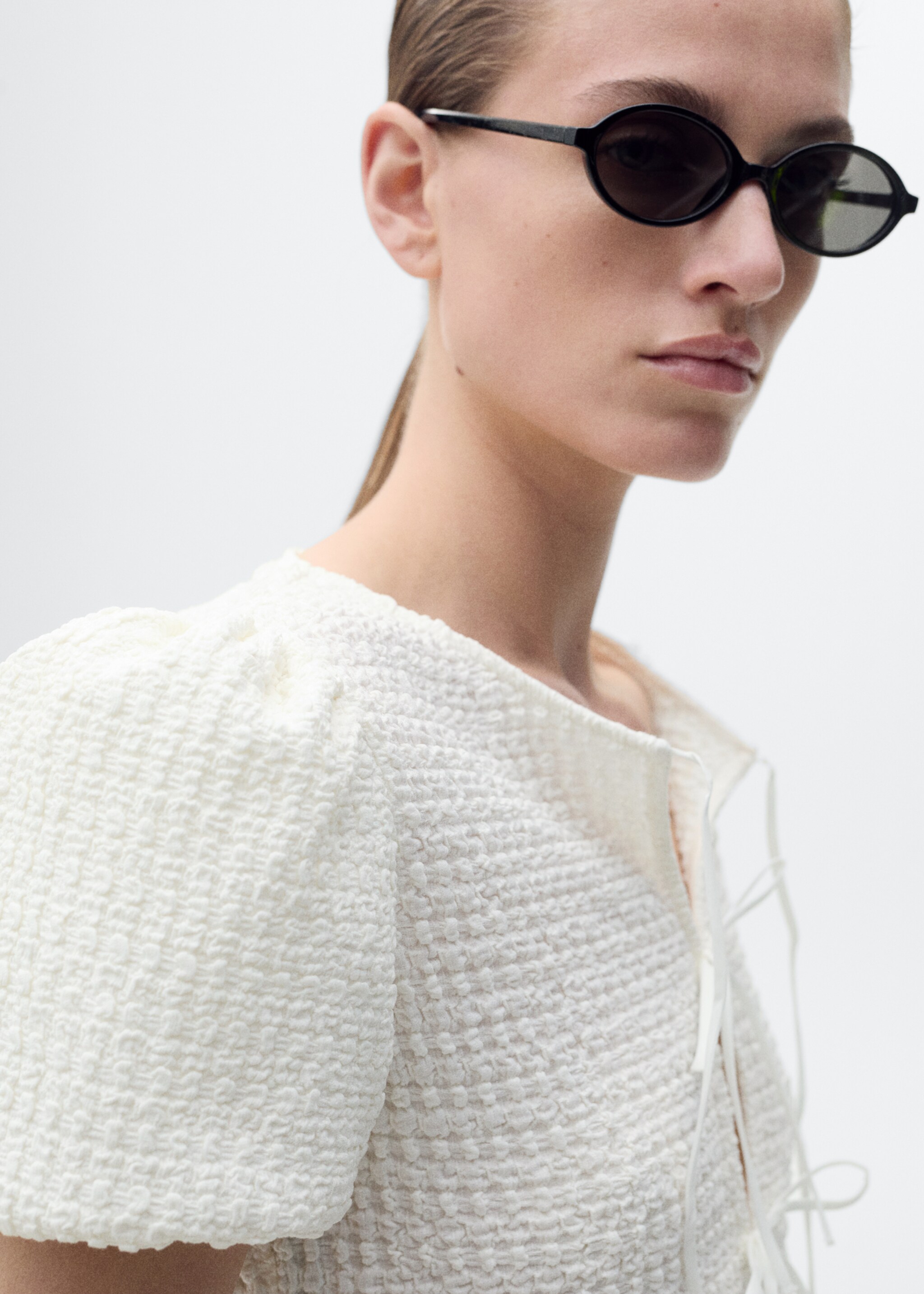 Textured blouse with bow closure - Details of the article 1
