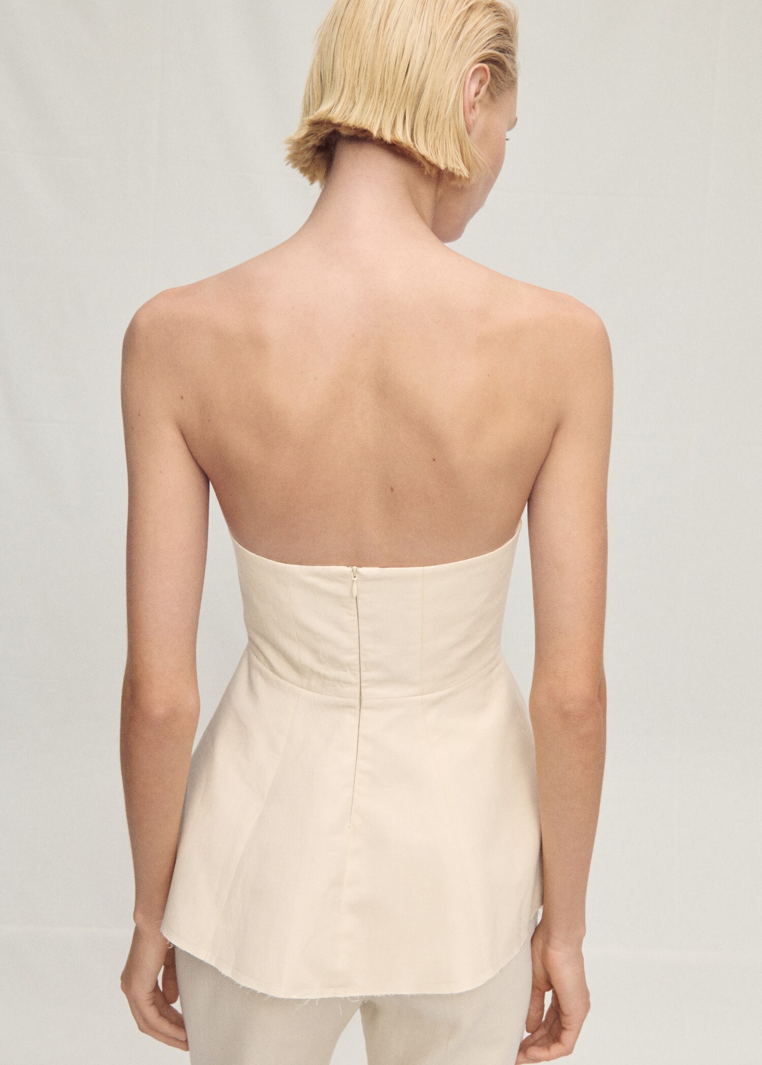 Strapless peplum top - Reverse of the article