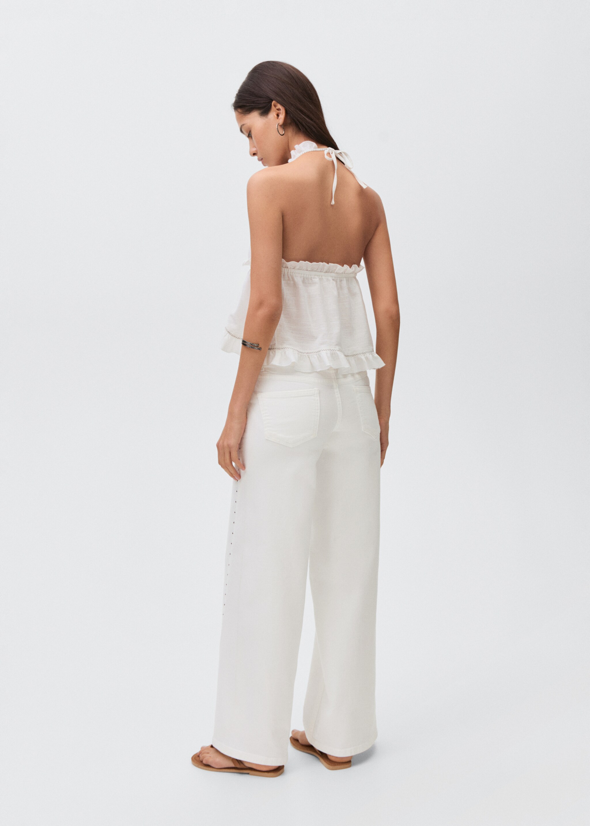 Low-waist studded jeans - Reverse of the article