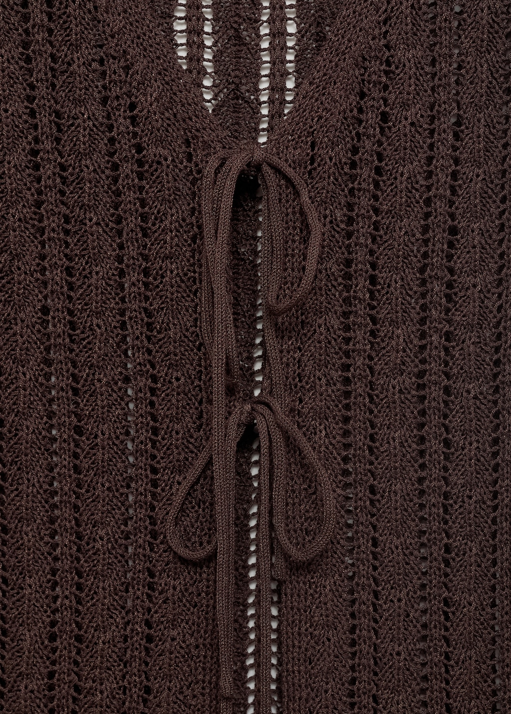 Knitted vest with bow closure